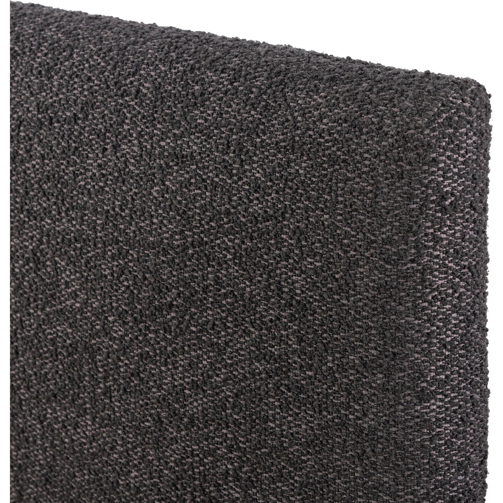 Modern, clean shaping meets inflated comfort with this padded, upholstered bed frame in a textural boucle-like pattern Amethyst Home provides interior design, new home construction design consulting, vintage area rugs, and lighting in the Winter Garden metro area.
