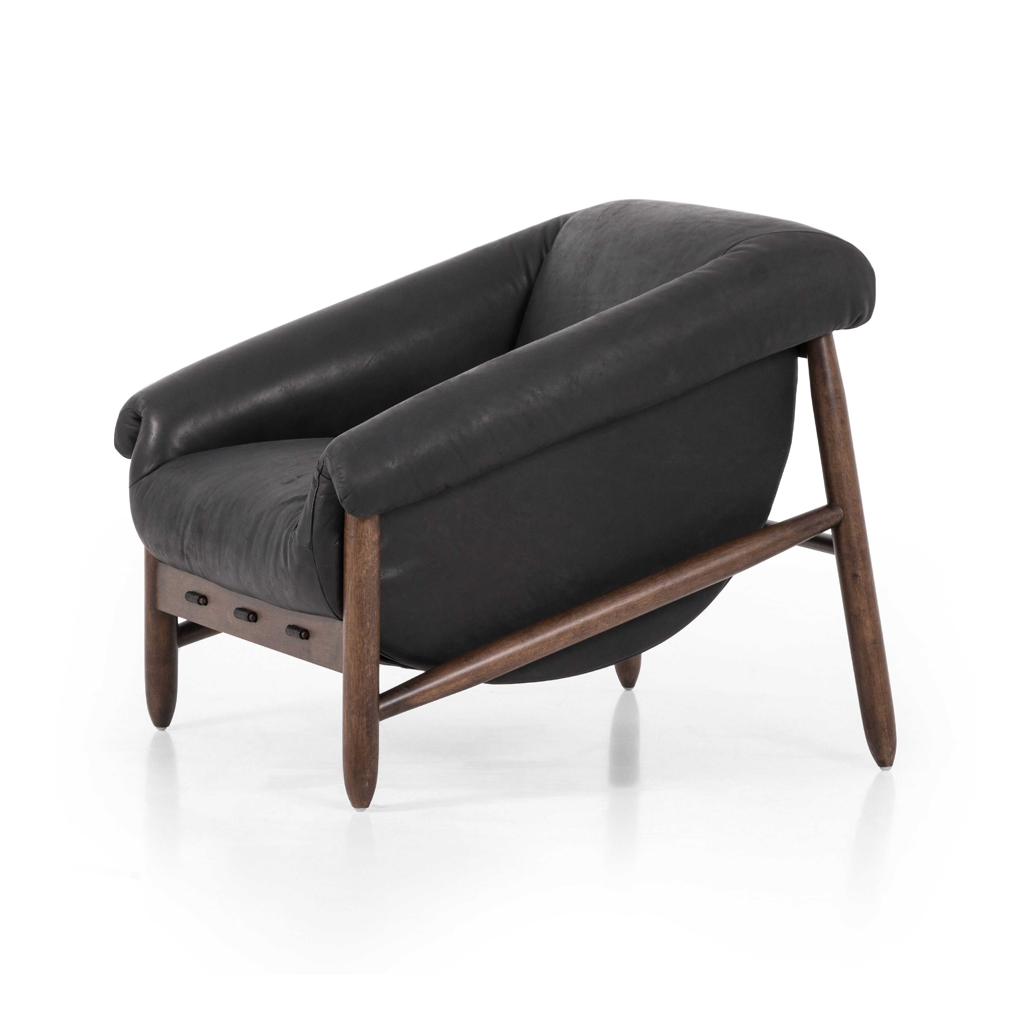 Featuring Reggie Heirloom Black Chair by Four Hands at Amethyst Home. Oversized cushioning brings a Brazilian midcentury feel to this vintage-inspired chair. Designed with cushion-wrapped slanted arms, fixed cushioning with a deep sit and narrow legs reminiscent of midcentury style. Upholstered in heirloom leather. Sourced from one of the oldest family-own. Amethyst Home provides interior design, new home construction design consulting, vintage area rugs, and lighting in the Alpharetta metro area.