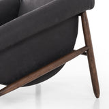 Featuring Reggie Heirloom Black Chair by Four Hands at Amethyst Home. Oversized cushioning brings a Brazilian midcentury feel to this vintage-inspired chair. Designed with cushion-wrapped slanted arms, fixed cushioning with a deep sit and narrow legs reminiscent of midcentury style. Upholstered in heirloom leather. Sourced from one of the oldest family-owned t. Amethyst Home provides interior design, new home construction design consulting, vintage area rugs, and lighting in the Austin metro area.