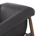 Featuring Reggie Heirloom Black Chair by Four Hands at Amethyst Home. Oversized cushioning brings a Brazilian midcentury feel to this vintage-inspired chair. Designed with cushion-wrapped slanted arms, fixed cushioning with a deep sit and narrow legs reminiscent of midcentury style. Upholstered in heirloom leather. Sourced from one of the oldest family-own. Amethyst Home provides interior design, new home construction design consulting, vintage area rugs, and lighting in the Des Moines metro area.
