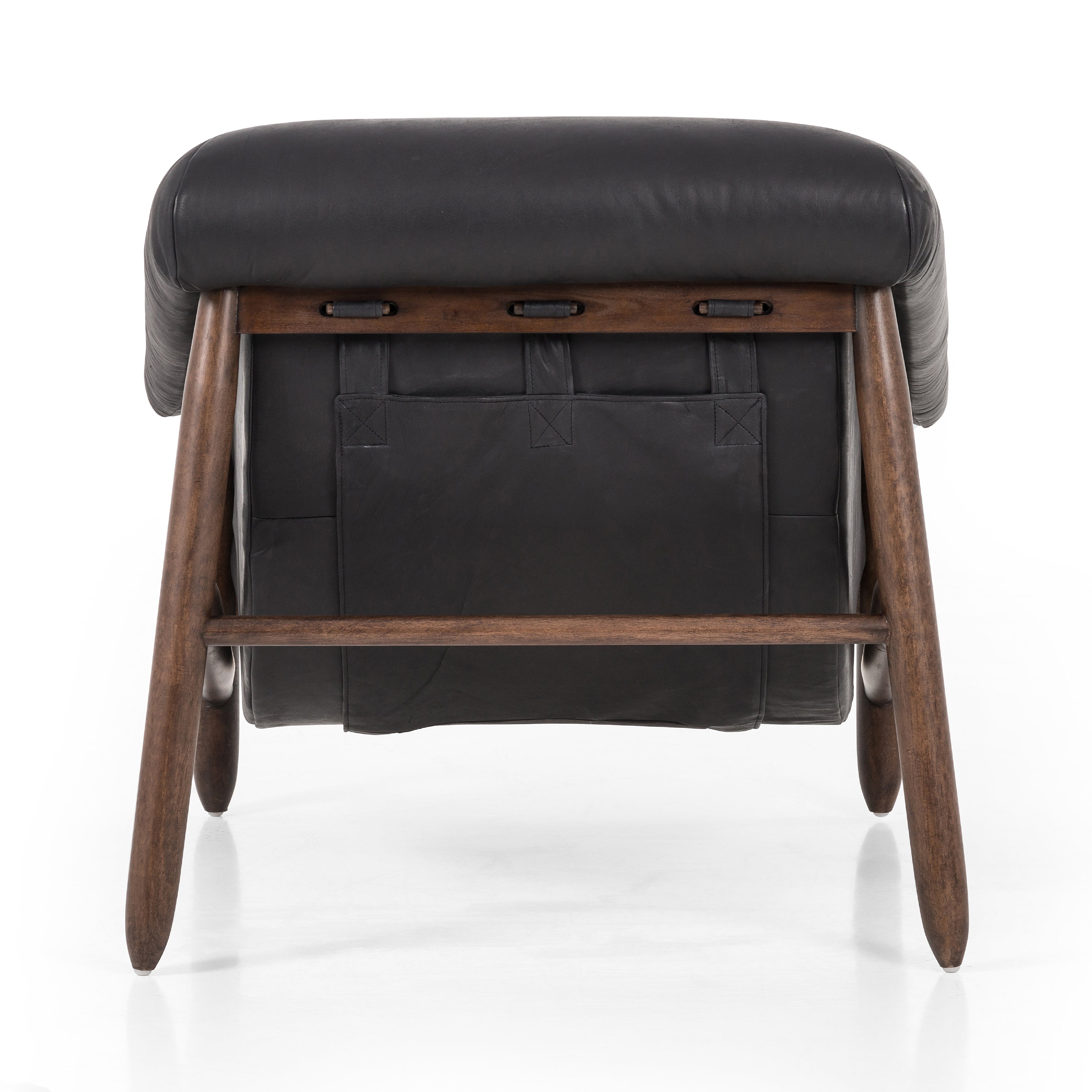 Featuring Reggie Heirloom Black Chair by Four Hands at Amethyst Home. Oversized cushioning brings a Brazilian midcentury feel to this vintage-inspired chair. Designed with cushion-wrapped slanted arms, fixed cushioning with a deep sit and narrow legs reminiscent of midcentury style. Upholstered in heirloom leather. Sourced from one of the oldest family-. Amethyst Home provides interior design, new home construction design consulting, vintage area rugs, and lighting in the Newport Beach metro area.