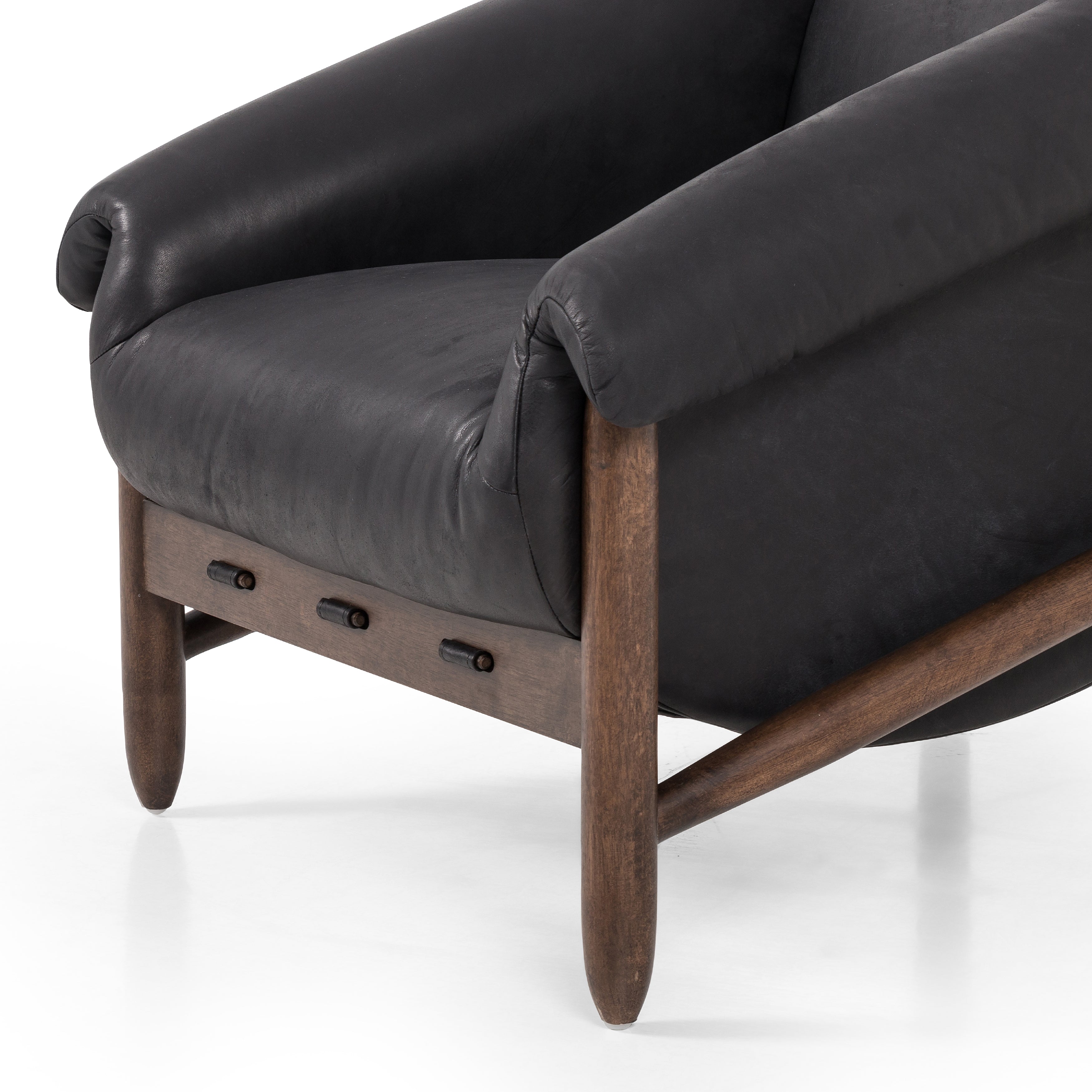 Featuring Reggie Heirloom Black Chair by Four Hands at Amethyst Home. Oversized cushioning brings a Brazilian midcentury feel to this vintage-inspired chair. Designed with cushion-wrapped slanted arms, fixed cushioning with a deep sit and narrow legs reminiscent of midcentury style. Upholstered in heirloom leather. Sourced from one of the oldest family-own. Amethyst Home provides interior design, new home construction design consulting, vintage area rugs, and lighting in the Scottsdale metro area.