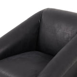 Featuring Reggie Heirloom Black Chair by Four Hands at Amethyst Home. Oversized cushioning brings a Brazilian midcentury feel to this vintage-inspired chair. Designed with cushion-wrapped slanted arms, fixed cushioning with a deep sit and narrow legs reminiscent of midcentury style. Upholstered in heirloom leather. Sourced from one of the oldest family-owned ta. Amethyst Home provides interior design, new home construction design consulting, vintage area rugs, and lighting in the Tampa metro area.