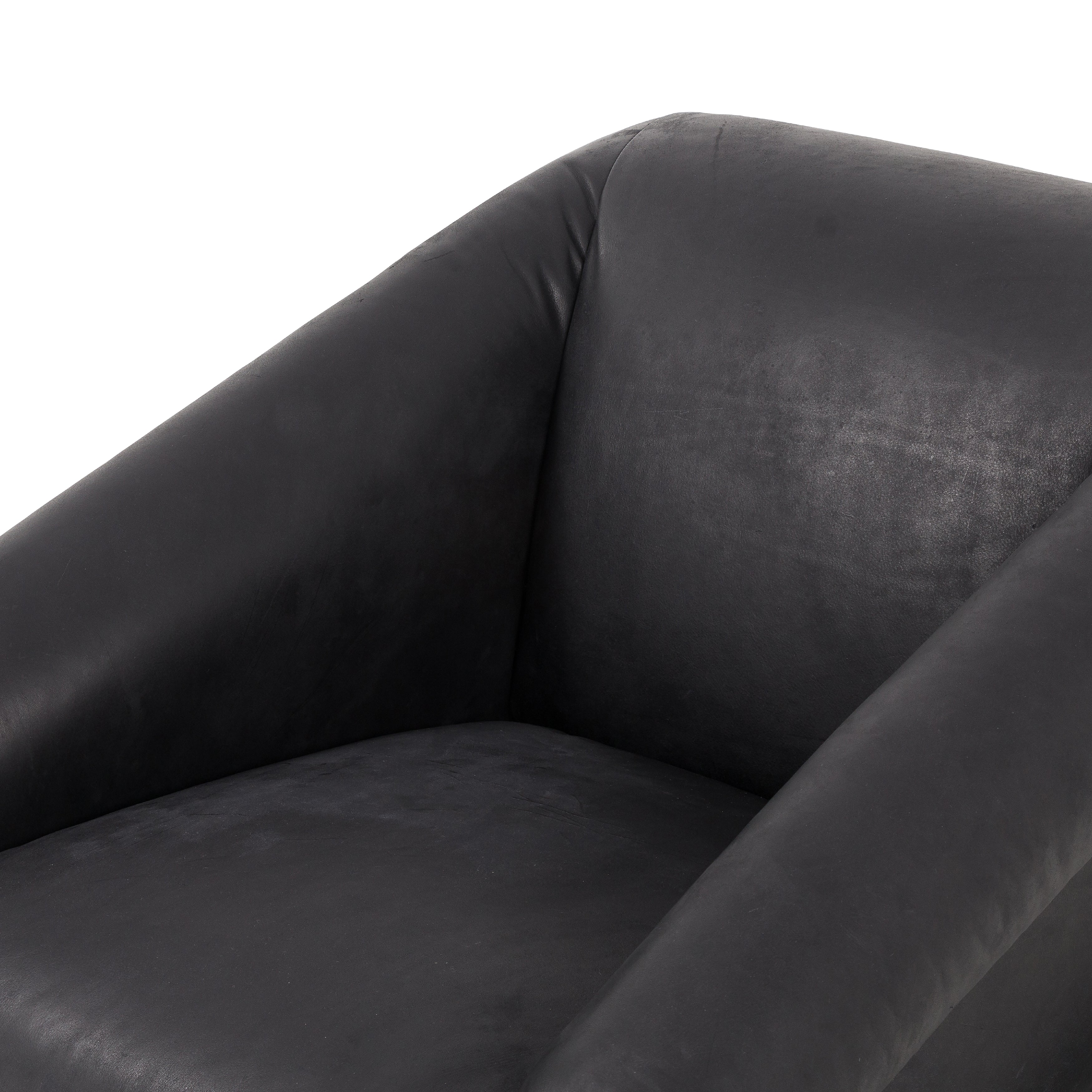 Featuring Reggie Heirloom Black Chair by Four Hands at Amethyst Home. Oversized cushioning brings a Brazilian midcentury feel to this vintage-inspired chair. Designed with cushion-wrapped slanted arms, fixed cushioning with a deep sit and narrow legs reminiscent of midcentury style. Upholstered in heirloom leather. Sourced from one of the oldest family-owned ta. Amethyst Home provides interior design, new home construction design consulting, vintage area rugs, and lighting in the Tampa metro area.