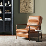 A sleek seat with hidden push-back reclining functionality. This midcentury-inspired recliner features wide chunky channeling paired with slim paddle arms and a tapered wood frame. Designed with a high seat and high back for extra comfy support. Upholstered in a timeless tobacco-hued leather made in a family-owned tannery in Thailand. Amethyst Home provides interior design, new construction, custom furniture, and area rugs in the Miami metro area.