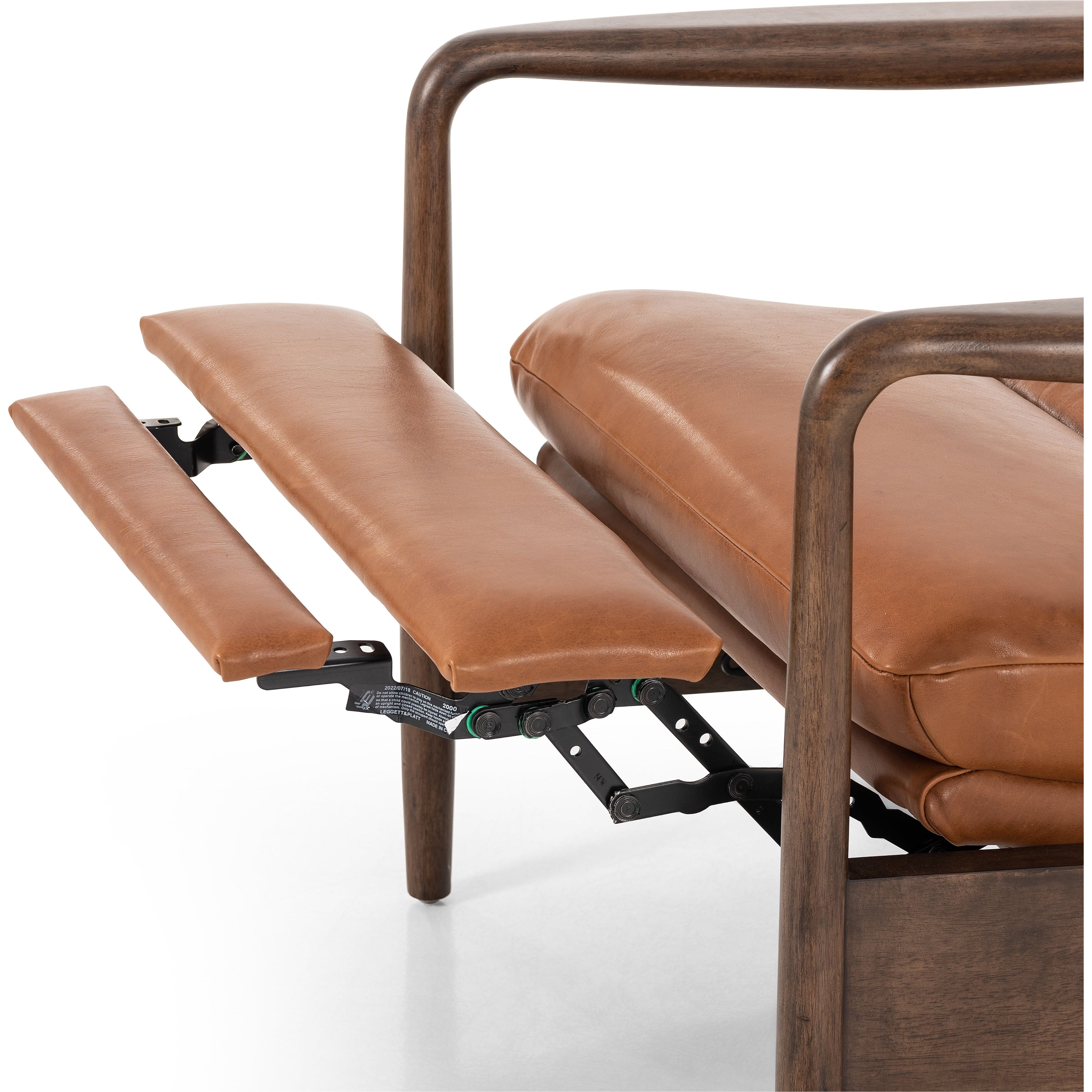 A sleek seat with hidden push-back reclining functionality. This midcentury-inspired recliner features wide chunky channeling paired with slim paddle arms and a tapered wood frame. Designed with a high seat and high back for extra comfy support. Upholstered in a timeless tobacco-hued leather made in a family-owned tannery in Thailand. Amethyst Home provides interior design, new construction, custom furniture, and area rugs in the Monterey metro area.