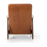 A sleek seat with hidden push-back reclining functionality. This midcentury-inspired recliner features wide chunky channeling paired with slim paddle arms and a tapered wood frame. Designed with a high seat and high back for extra comfy support. Upholstered in a timeless tobacco-hued leather made in a family-owned tannery in Thailand. Amethyst Home provides interior design, new construction, custom furniture, and area rugs in the Salt Lake City metro area.
