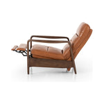A sleek seat with hidden push-back reclining functionality. This midcentury-inspired recliner features wide chunky channeling paired with slim paddle arms and a tapered wood frame. Designed with a high seat and high back for extra comfy support. Upholstered in a timeless tobacco-hued leather made in a family-owned tannery in Thailand. Amethyst Home provides interior design, new construction, custom furniture, and area rugs in the Scottsdale metro area.