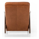 A sleek seat with hidden push-back reclining functionality. This midcentury-inspired recliner features wide chunky channeling paired with slim paddle arms and a tapered wood frame. Designed with a high seat and high back for extra comfy support. Upholstered in a timeless tobacco-hued leather made in a family-owned tannery in Thailand. Amethyst Home provides interior design, new construction, custom furniture, and area rugs in the Tampa metro area.