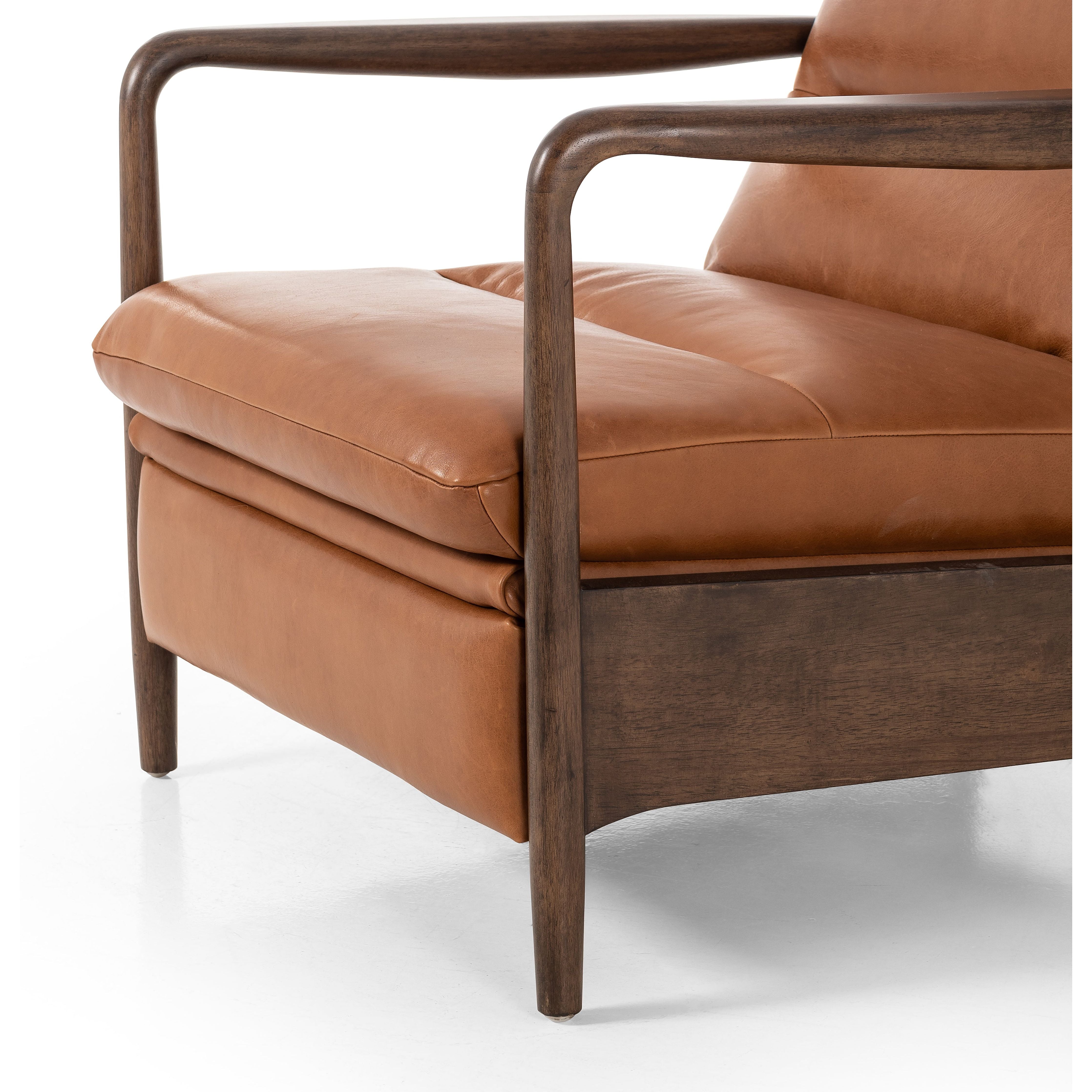 A sleek seat with hidden push-back reclining functionality. This midcentury-inspired recliner features wide chunky channeling paired with slim paddle arms and a tapered wood frame. Designed with a high seat and high back for extra comfy support. Upholstered in a timeless tobacco-hued leather made in a family-owned tannery in Thailand. Amethyst Home provides interior design, new construction, custom furniture, and area rugs in the Washington metro area.