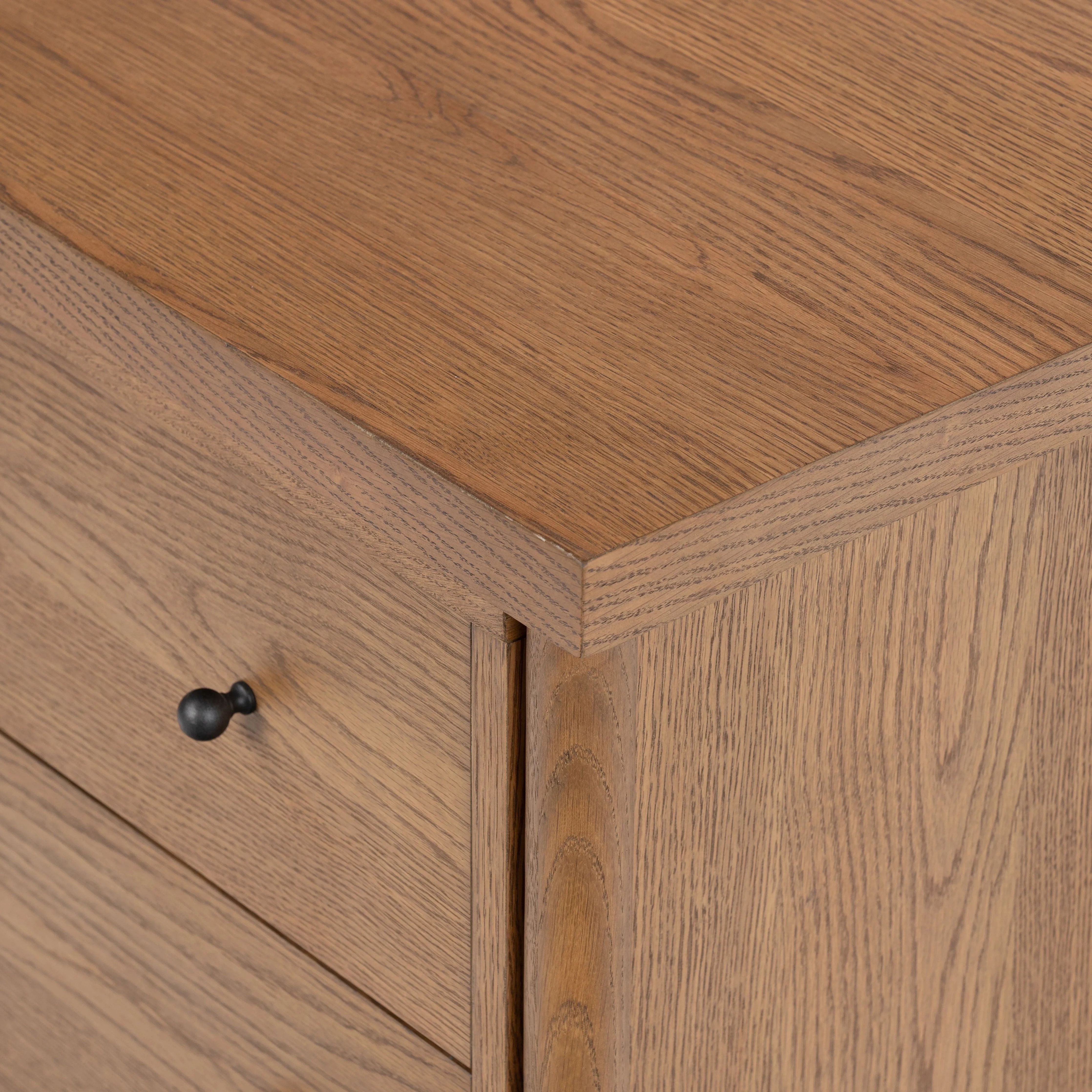 Rounded, chunky dowel legs in an amber oak finish support the overhang top of of this nightstand. Two drawers provide ample storage, finished with simple gunmetal hardware Amethyst Home provides interior design, new home construction design consulting, vintage area rugs, and lighting in the Boston metro area.