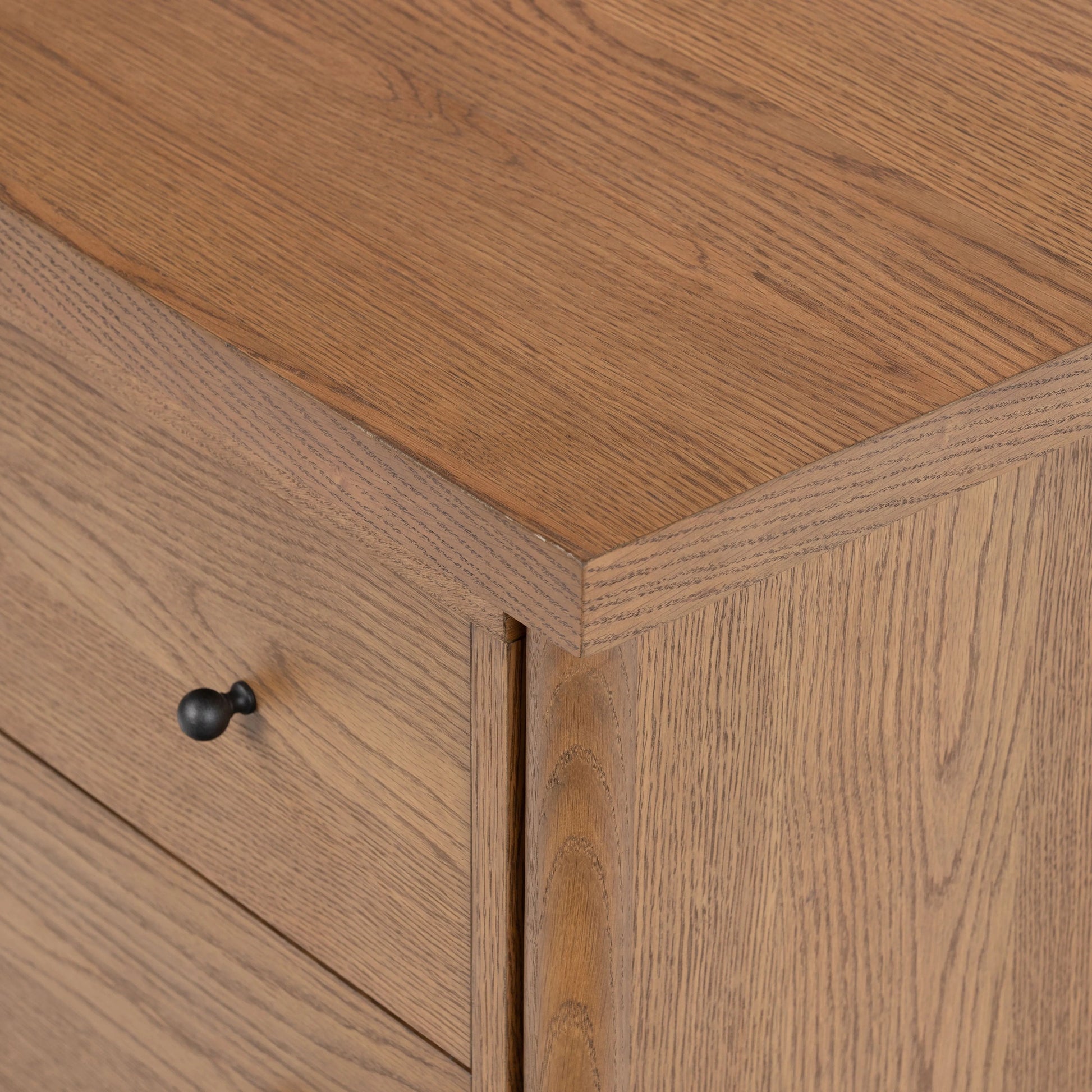 Rounded, chunky dowel legs in an amber oak finish support the overhang top of of this nightstand. Two drawers provide ample storage, finished with simple gunmetal hardware Amethyst Home provides interior design, new home construction design consulting, vintage area rugs, and lighting in the Boston metro area.