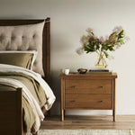 Rounded, chunky dowel legs in an amber oak finish support the overhang top of of this nightstand. Two drawers provide ample storage, finished with simple gunmetal hardware Amethyst Home provides interior design, new home construction design consulting, vintage area rugs, and lighting in the Miami metro area.