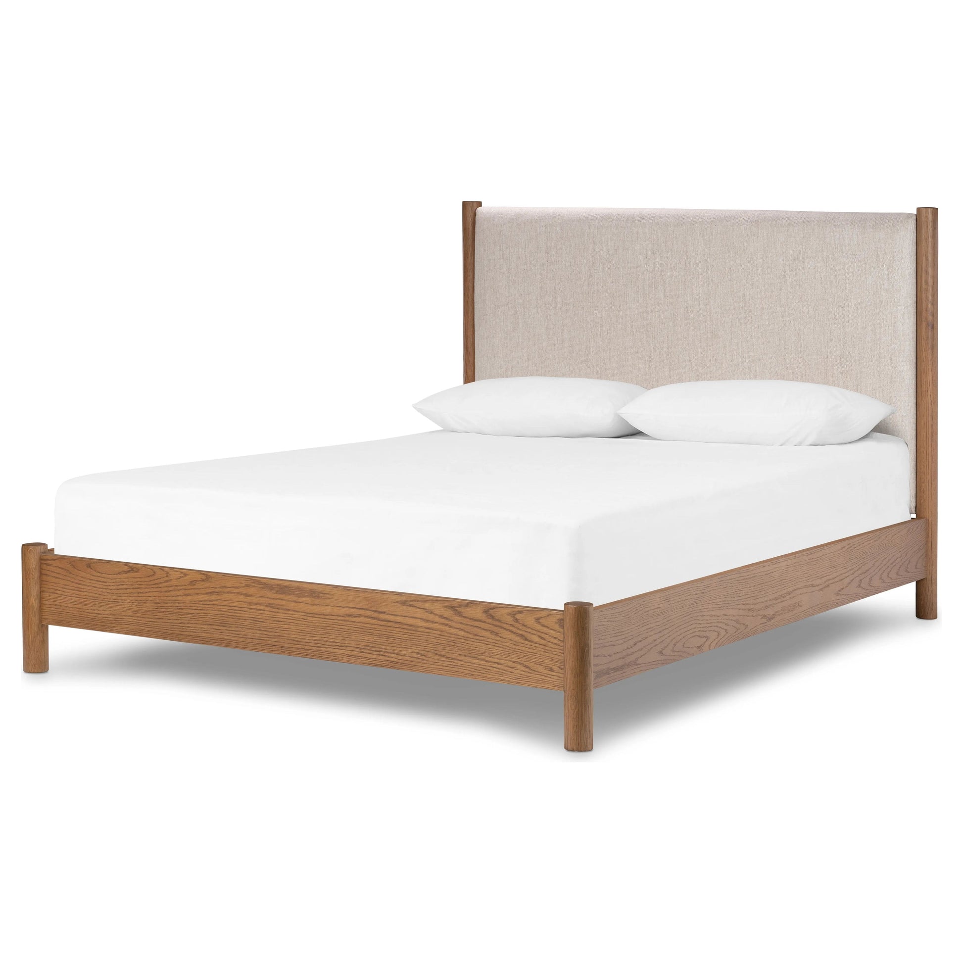 Rounded, chunky dowel legs in an amber oak finish frame the neutral, linen-like upholstered headboard of this bed frame Amethyst Home provides interior design, new home construction design consulting, vintage area rugs, and lighting in the Los Angeles metro area.