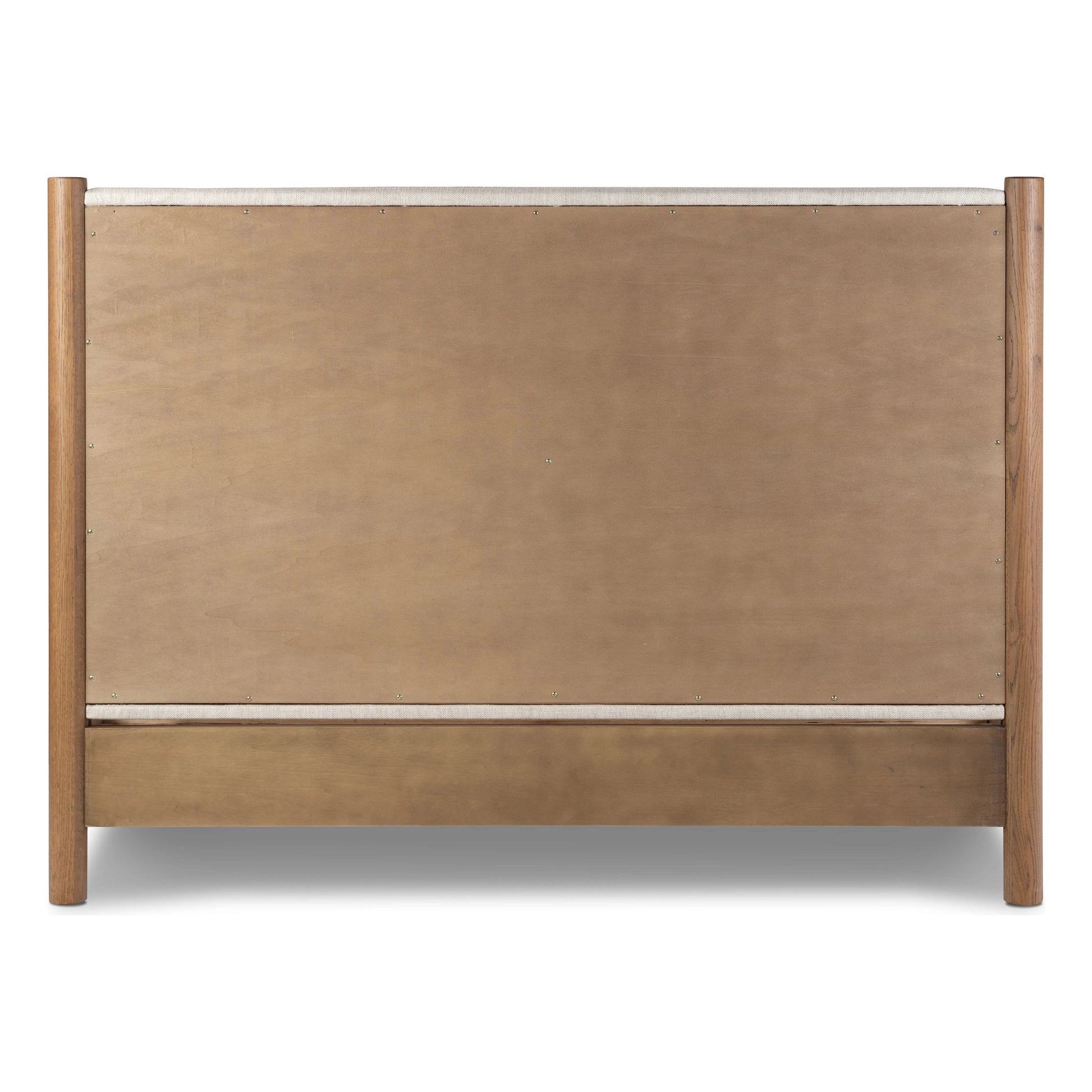 Rounded, chunky dowel legs in an amber oak finish frame the neutral, linen-like upholstered headboard of this bed frame Amethyst Home provides interior design, new home construction design consulting, vintage area rugs, and lighting in the Portland metro area.