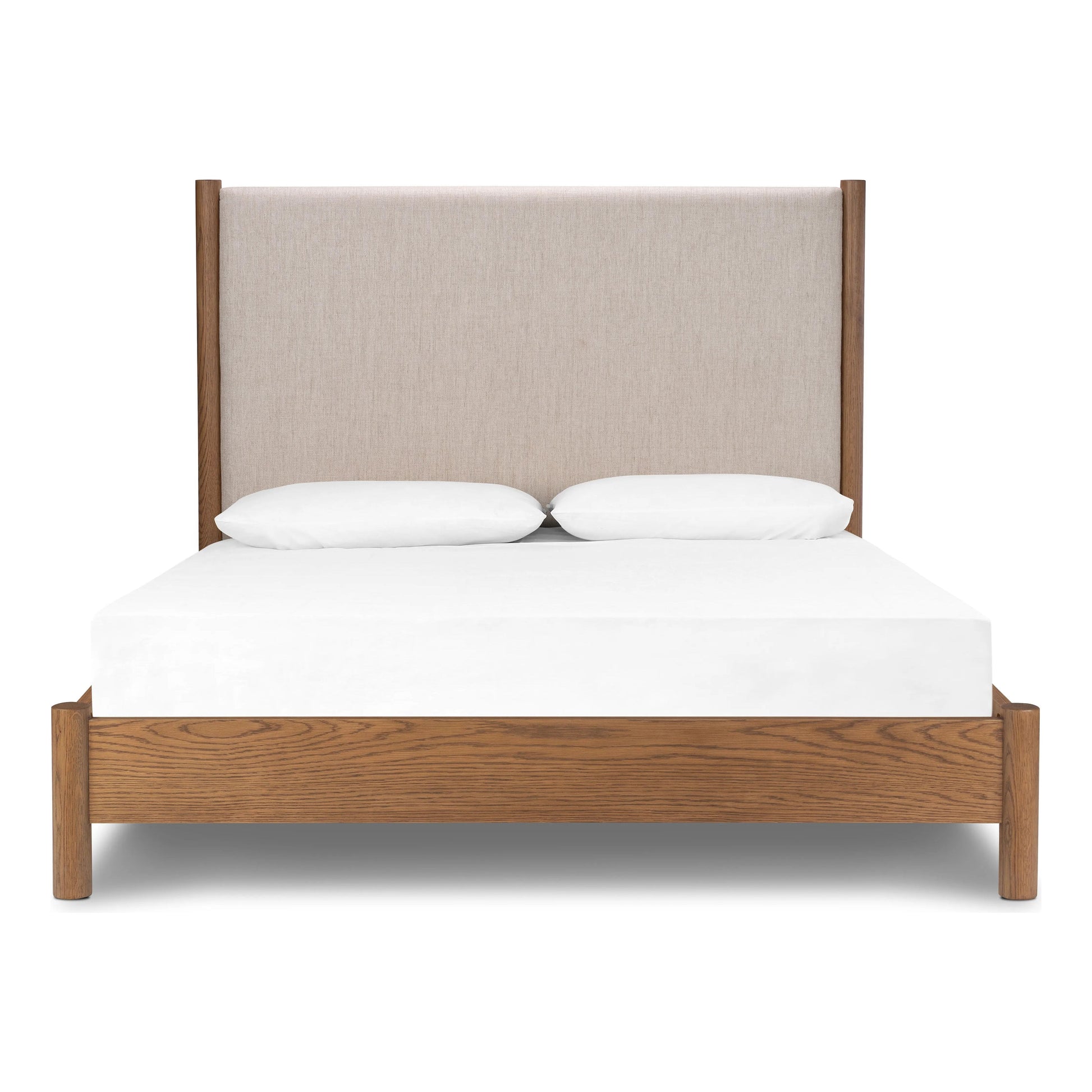 Rounded, chunky dowel legs in an amber oak finish frame the neutral, linen-like upholstered headboard of this bed frame Amethyst Home provides interior design, new home construction design consulting, vintage area rugs, and lighting in the Winter Garden metro area.
