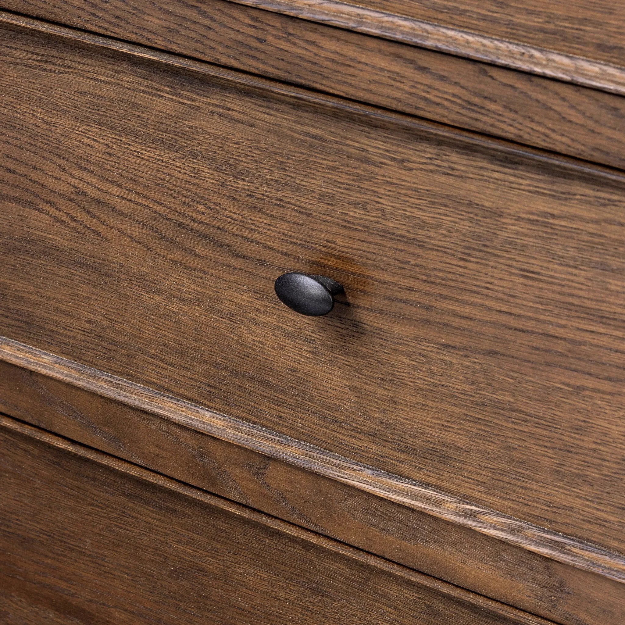 Featuring Russ Aged Oak Oversized Dresser by Four Hands at Amethyst Home. Like an heirloom dresser with three smaller drawers up top, this aged oak design has room for it all. Detailed with an overhang surface, carved edges top to bottom, angled legs and oval drawer pulls finished in dark gunmetal.
Overall Dimensions: 21.0" L x 72.0" W x 38.75" H
Collection. Amethyst Home provides interior design, new home construction design consulting, vintage area rugs, and lighting in the Nashville metro area.