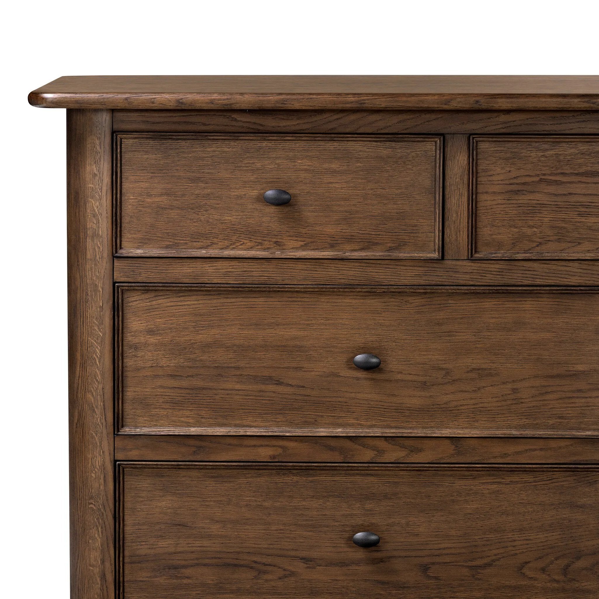 Like an heirloom dresser with three smaller drawers up top, this aged oak design has room for it all. Detailed with an overhang surface, carved edges top to bottom, angled legs and oval drawer pulls finished in dark gunmetal.Collection: Bolto Amethyst Home provides interior design, new home construction design consulting, vintage area rugs, and lighting in the Scottsdale metro area.