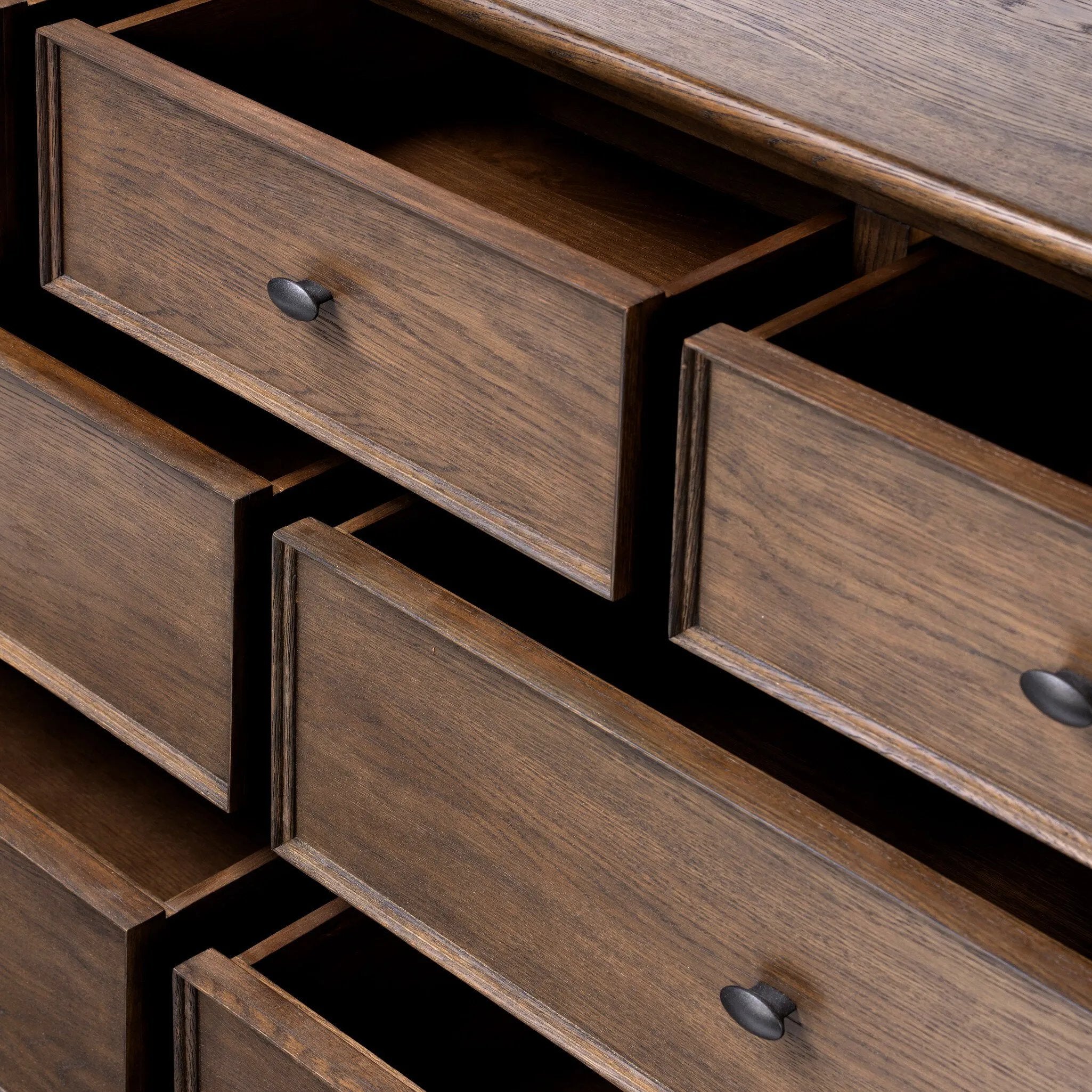 Like an heirloom dresser with three smaller drawers up top, this aged oak design has room for it all. Detailed with an overhang surface, carved edges top to bottom, angled legs and oval drawer pulls finished in dark gunmetal.Collection: Bolto Amethyst Home provides interior design, new home construction design consulting, vintage area rugs, and lighting in the Tampa metro area.