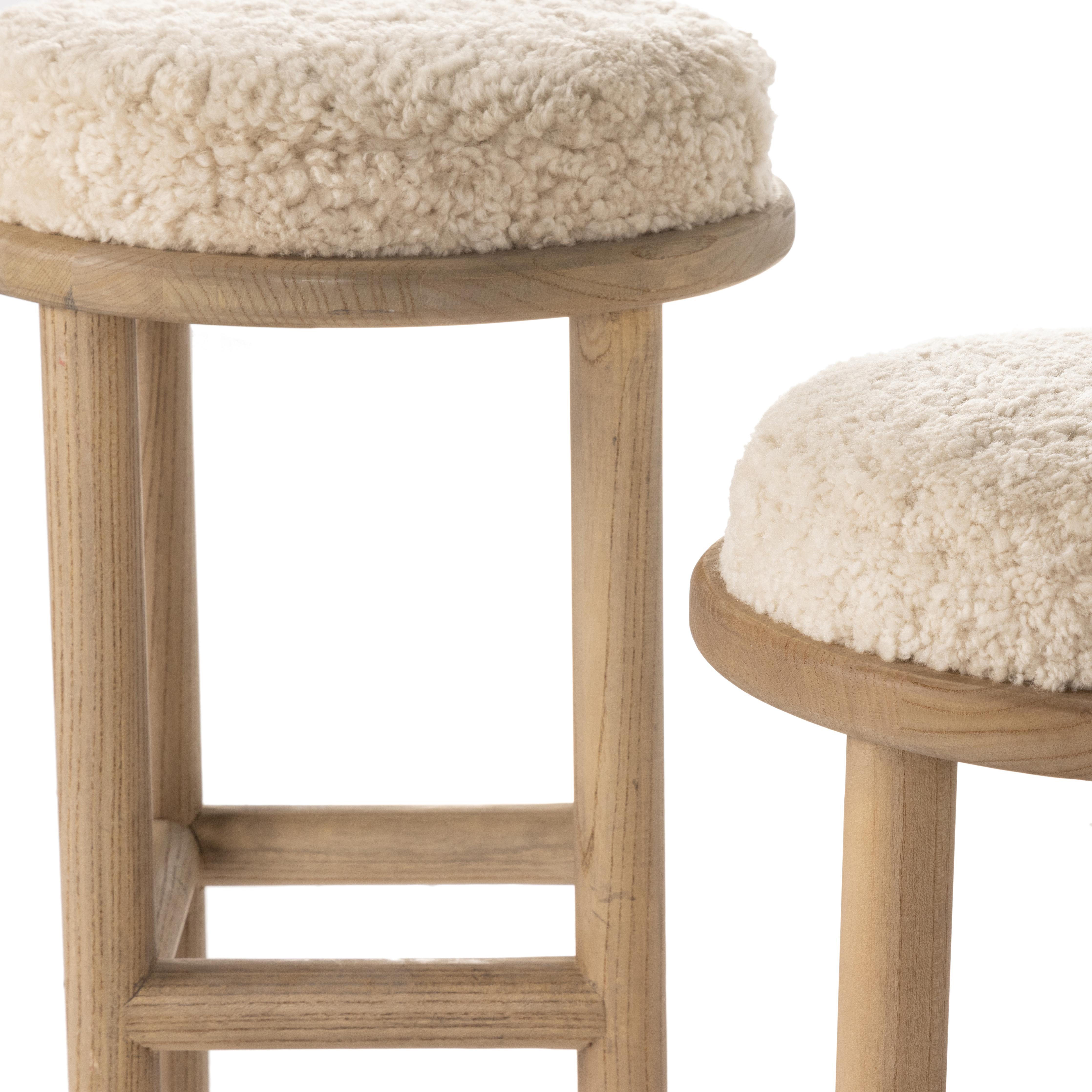 Featuring Saldino Stool by Four Hands at Amethyst Home. Bring a textural touch to the counter with the Saldino stool. Blonde-finished solid parawood supports rounded seating of soft beige shearling for comfort and style alike.
Overall Dimensions: 17"W x 17"L x 26"HColors: Blonde Nettlewood, Beige ShearlingMaterials: Solid Nettlewood, Shearling Weight: 15.21 . Amethyst Home provides interior design, new home construction design consulting, vintage area rugs, and lighting in the Portland metro area.