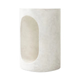 Made from textured white concrete, a cylinder shaped end table features a pill-shaped cutout for a light look. Subtle mottling adds a hint of texture.Collection: Chandle Amethyst Home provides interior design, new home construction design consulting, vintage area rugs, and lighting in the Laguna Beach metro area.