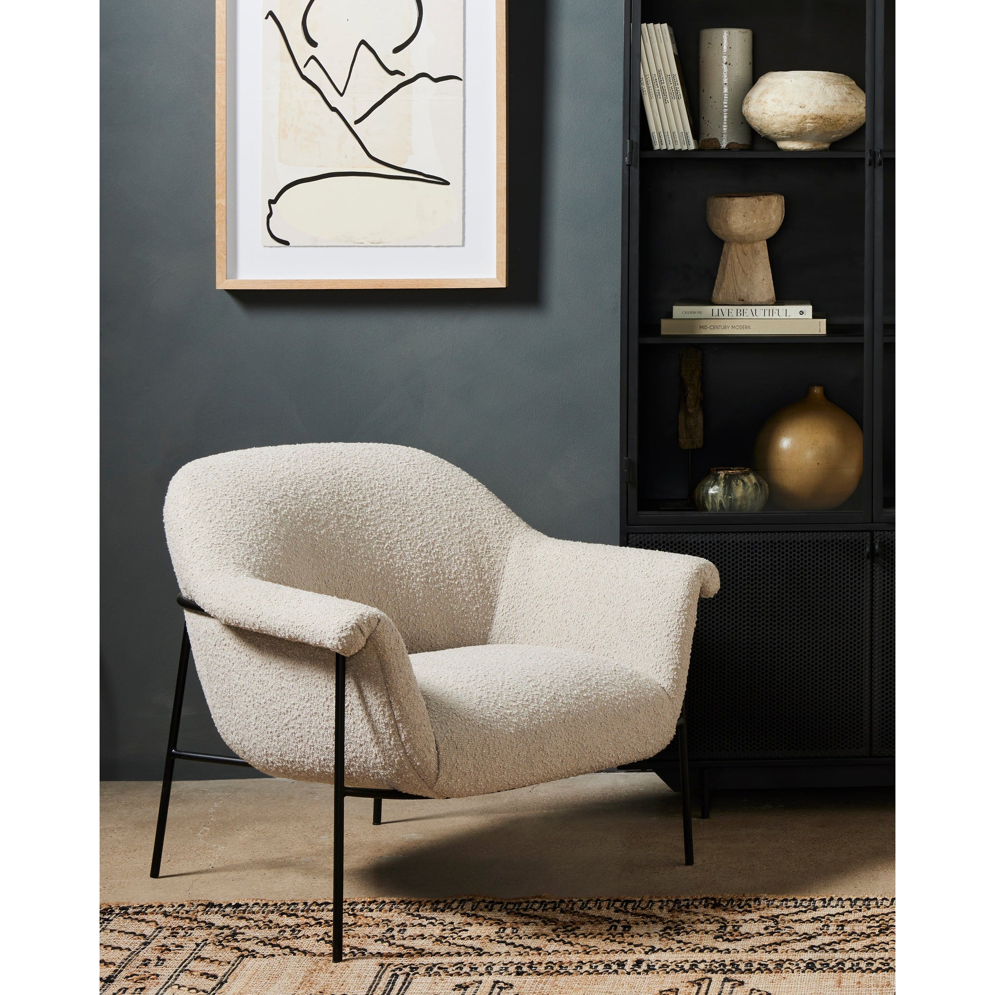 With a curvy silhouette and classic rolled arms, soft boucle lends a fresh feel to comfortable accent seating, with an airy iron cradle base for a beautiful balance of scale. Performance fabrics are specially created to withstand spills, stains, high traffic and wear, ensuring long-term comfort and unmatched durability. Amethyst Home provides interior design, new construction, custom furniture, and area rugs in the Omaha metro area.