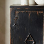 By the makers at Van Thiel, known for their antique-inspired pieces and hand-applied finishes.  This wide but slim solid pine cabinet features door fronts with diamond cutout details and wire mesh inserts. Detailed with antique-inspired hardware and hinges. Metal-clad top in oil-rubbed bronze finish. Amethyst Home provides interior design, new home construction design consulting, vintage area rugs, and lighting in the Tampa metro area.