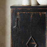 By the makers at Van Thiel, known for their antique-inspired pieces and hand-applied finishes.  This wide but slim solid pine cabinet features door fronts with diamond cutout details and wire mesh inserts. Detailed with antique-inspired hardware and hinges. Metal-clad top in oil-rubbed bronze finish. Amethyst Home provides interior design, new home construction design consulting, vintage area rugs, and lighting in the Tampa metro area.