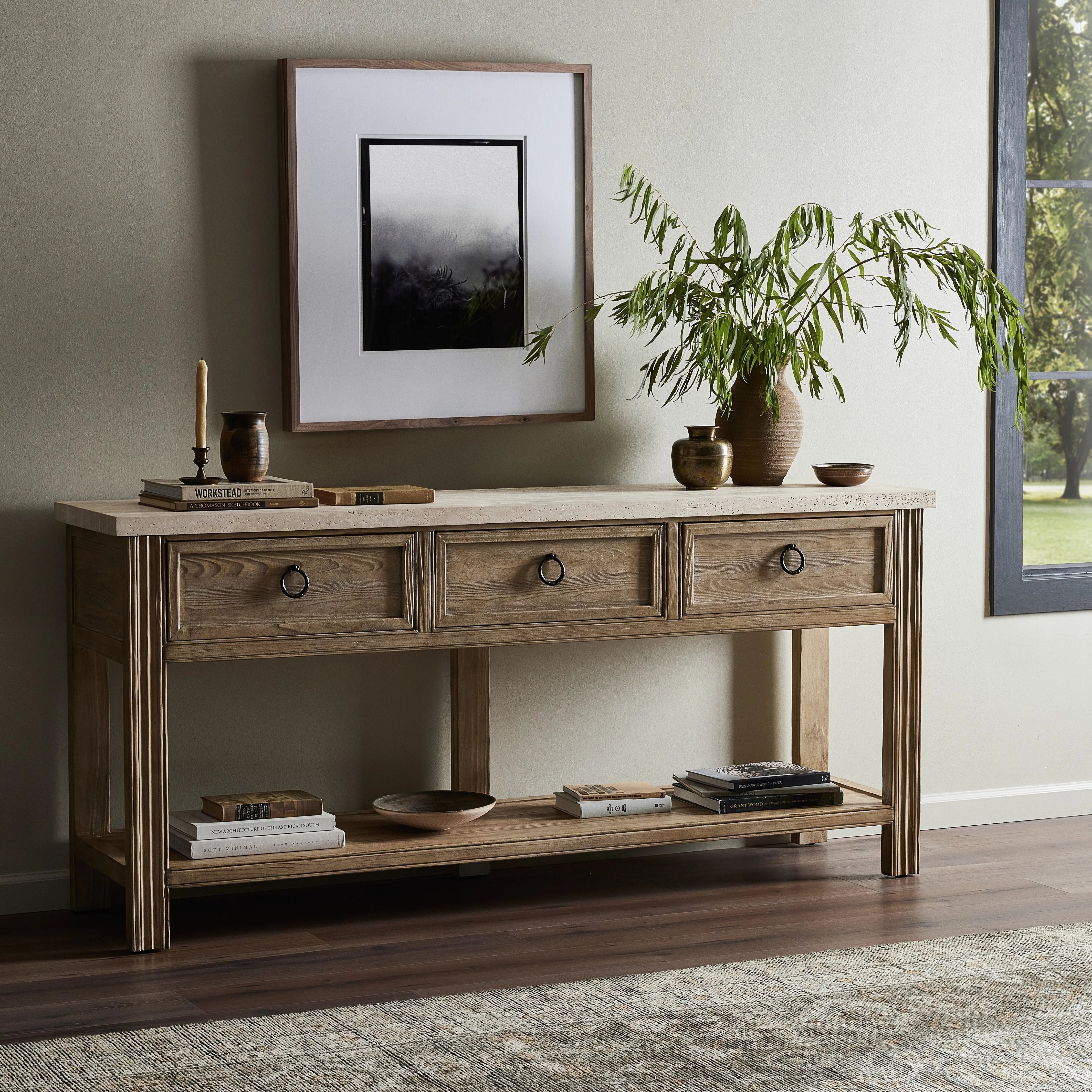 Bring bonus storage space to the media room or entryway. Made from solid pine and finished in an ash grey, with facet detailing and a smooth, silver travertine top. Handmade hardware adorns three spacious drawers. By the makers at Van Thiel, known for their antique-inspired pieces and hand-applied finishes.Collection: Van Thie Amethyst Home provides interior design, new home construction design consulting, vintage area rugs, and lighting in the Alpharetta metro area.