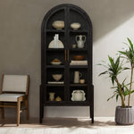 Featuring Tolle Drifted Matte Black Cabinet by Four Hands at Amethyst Home. Made from black-finished solid oak, French-inspired cabinetry features an arched top, spacious interior and a clear glass front for storage and display.
Collection: IrondaleColors: Antique Brass ,Drifted BlackMaterials: Iron ,Solid Oak Weight: 185.3 lbsOverall Dimensions: 38"W x 19"L x 84"HVolume: 51.74 c. Amethyst Home provides interior design, new construction, custom furniture, and area rugs in the Calabasas metro area.