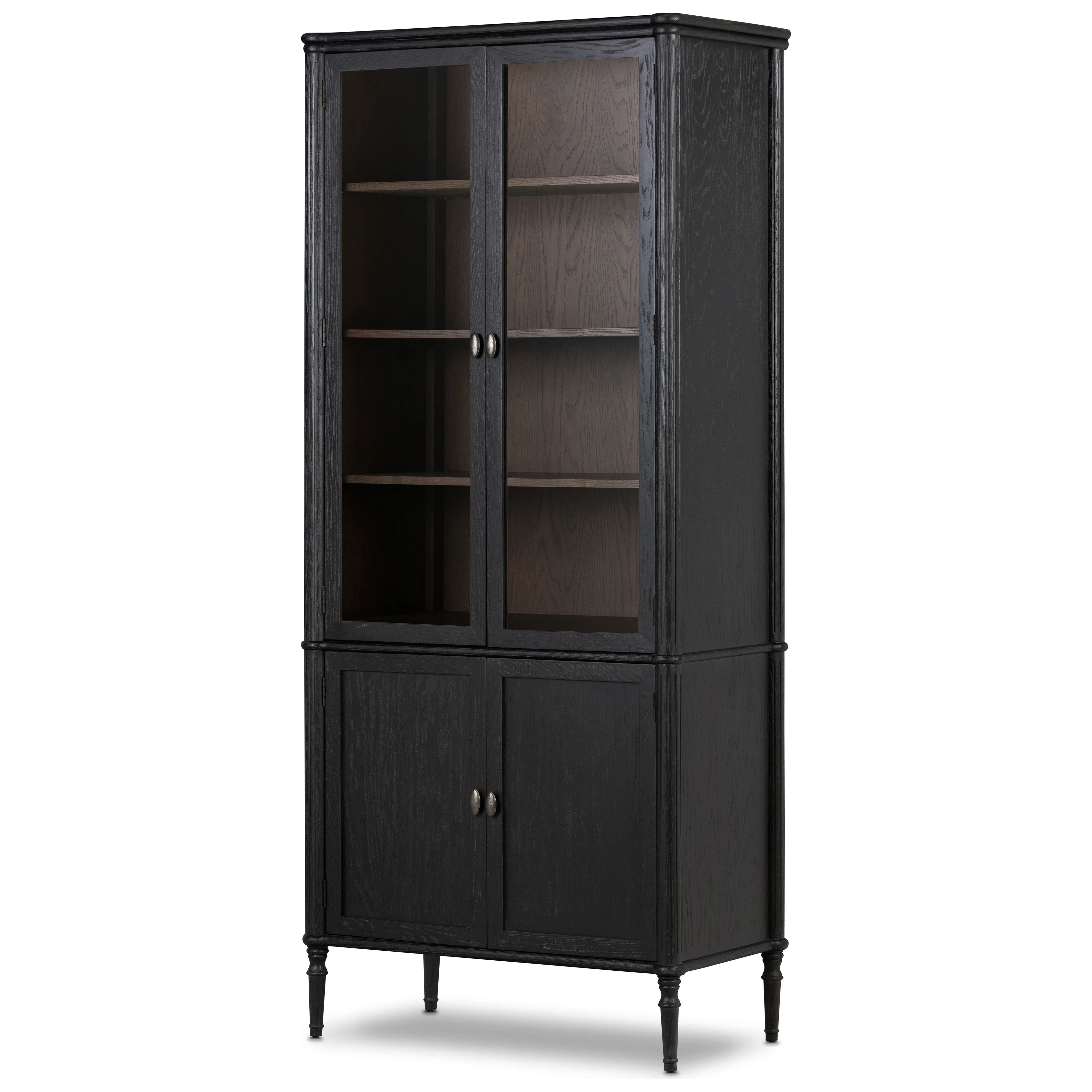 Framed panels, subtly softened corners and tapered spindle legs speak to the vintage European inspiration behind this spacious cabinetry style. Made from solid oak and oak veneer and finished in a distressed black Amethyst Home provides interior design, new home construction design consulting, vintage area rugs, and lighting in the Los Angeles metro area.
