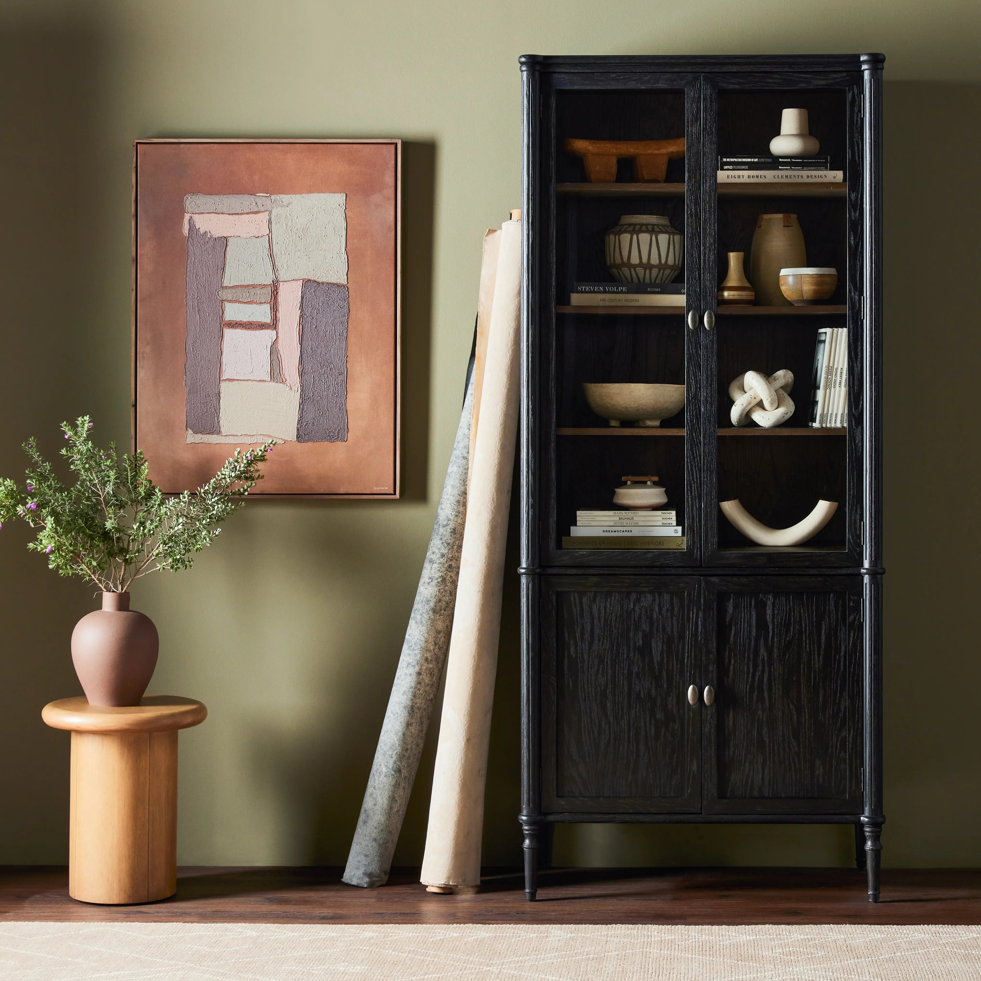 Framed panels, subtly softened corners and tapered spindle legs speak to the vintage European inspiration behind this spacious cabinetry style. Made from solid oak and oak veneer and finished in a distressed black Amethyst Home provides interior design, new home construction design consulting, vintage area rugs, and lighting in the Washington metro area.