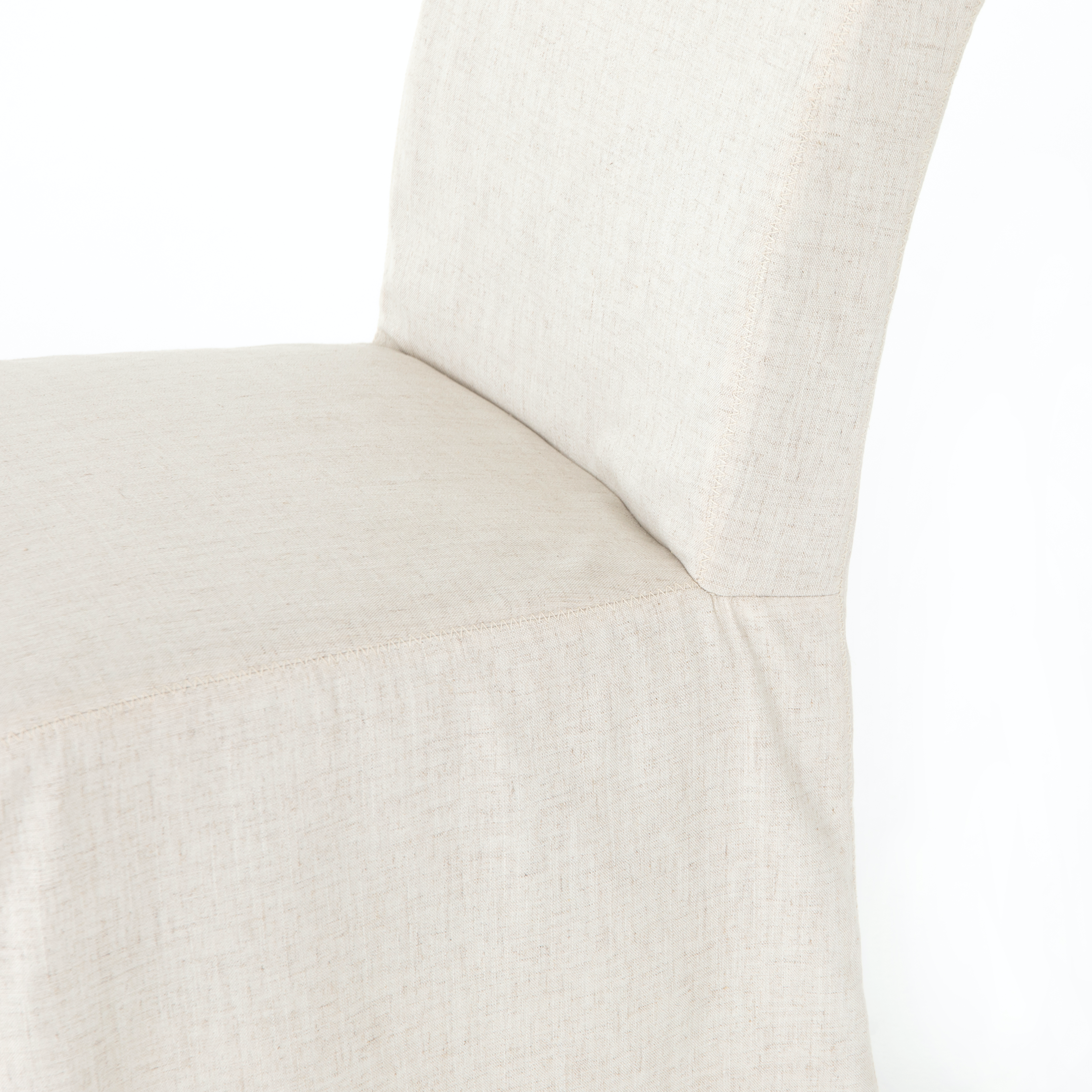The slipcovered Vista Savile Flax Dining Chair delights with a tall, enticingly curved silhouette and ivory performance-grade fabric. Amethyst Home provides interior design, new construction, custom furniture, and rugs for the Nashville metro area.