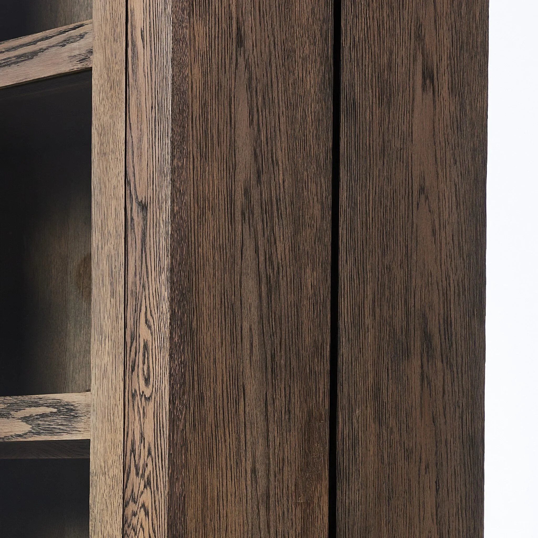 This minimal-inspired bookcase is crafted from a mix of solid oak and worn oak veneer. Featuring glass-front doors and spacious shelves for storage and display.Collection: Bennet Amethyst Home provides interior design, new home construction design consulting, vintage area rugs, and lighting in the Los Angeles metro area.
