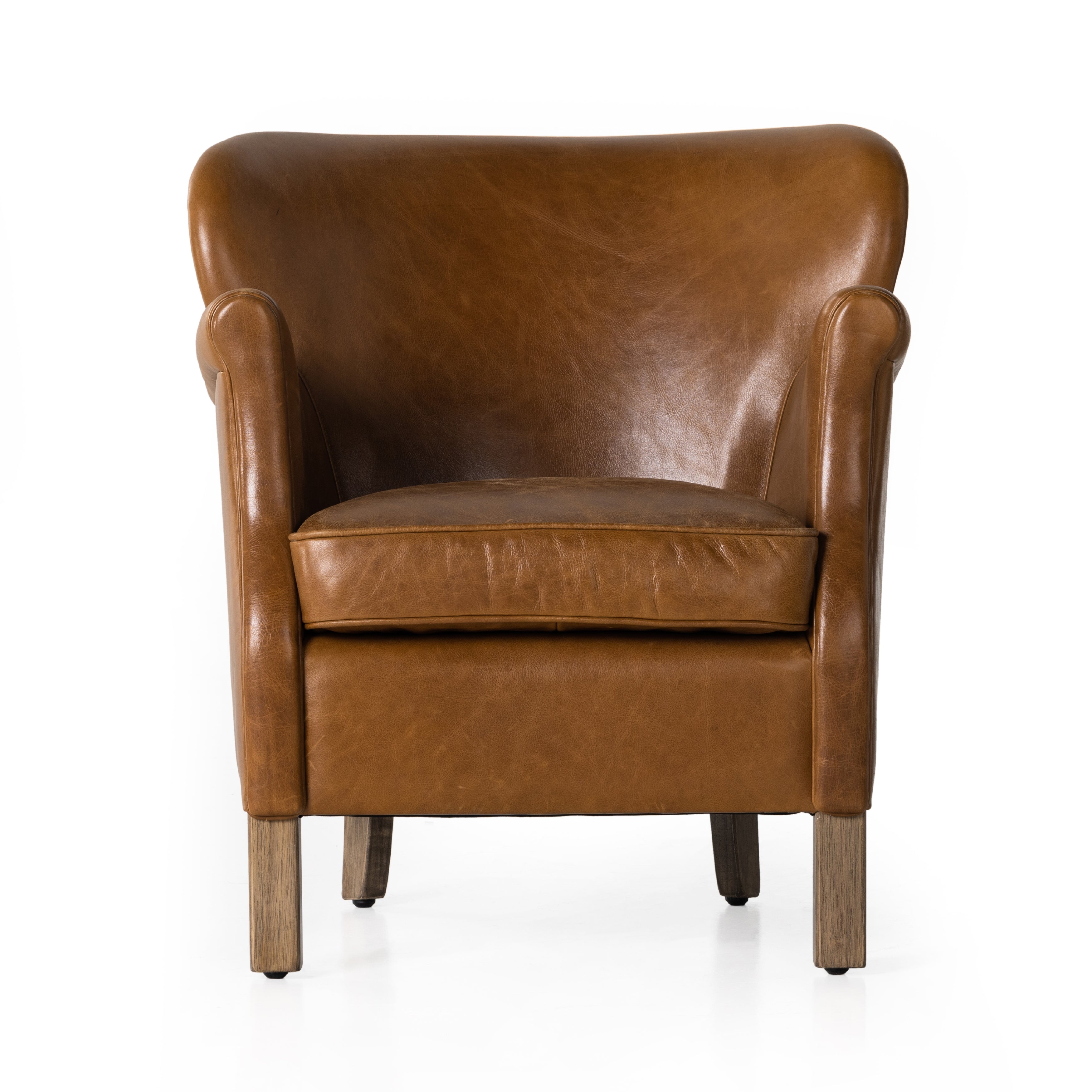 A statement seat all its own. This regal Parisian club chair is honored with a profound scooped back and rolled arms in classic, lived in tan top-grain leather. Amethyst Home provides interior design, new construction, custom furniture, and area rugs in the Washington metro area.