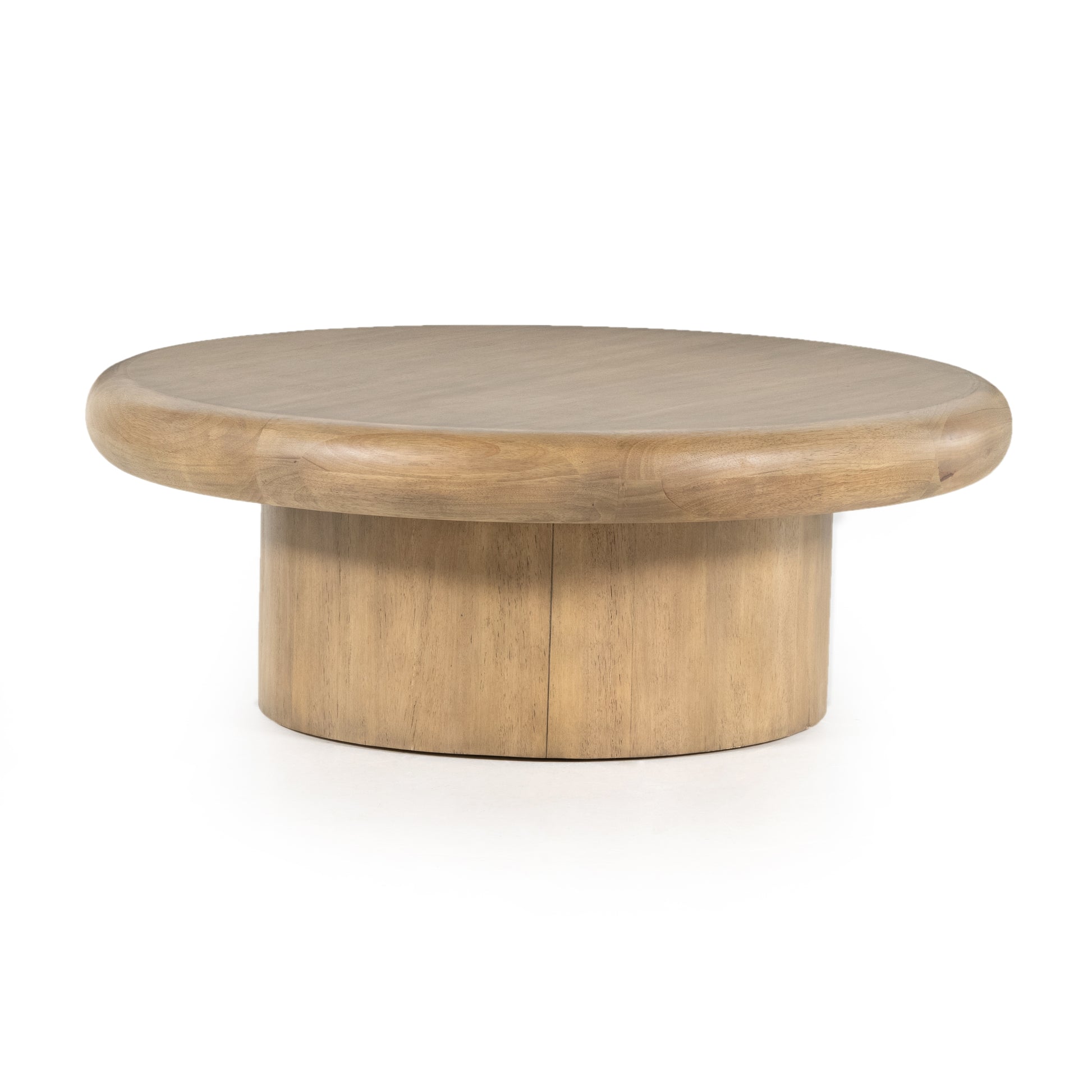 The Zach coffee table in burnished parawood features a pedestal-style base on a rounded tabletop with bullnose edging, for style and softness alike. Amethyst Home provides interior design, furniture, rugs, and design services in the Anaheim metro area.