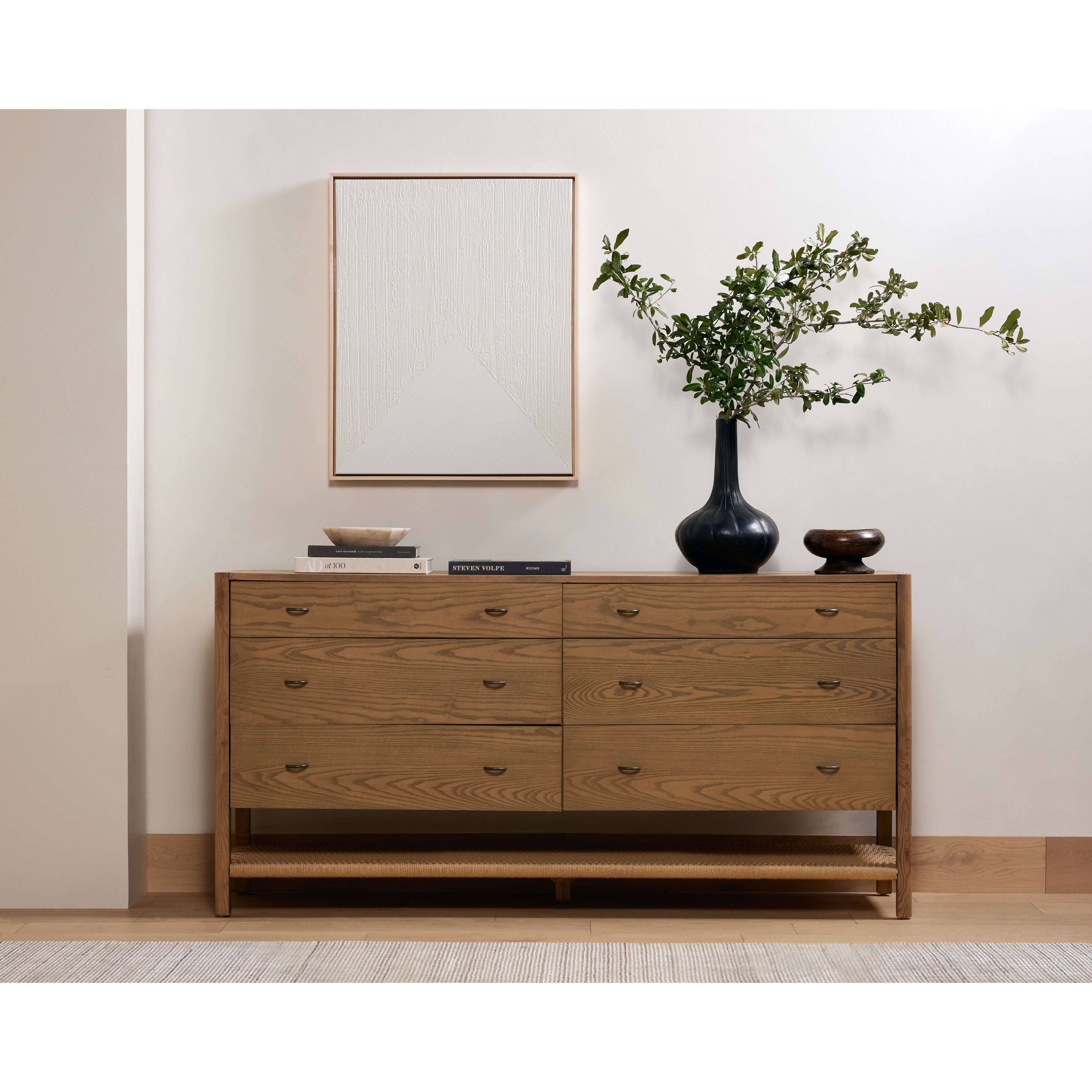 Featuring Zuma Dune Ash 6 Drawer Dresser by Four Hands at Amethyst Home. Simple yet refined, the Zuma Dune Ash 6 Drawer Dresser is a danish design-influenced dresser that is made from solid ash, with iron hardware finished in a sleek gunmetal. Stretcher-style shelving made from woven paper cord serves up a textural finishing touch. Six spacious drawers bring generous storage space to the bed. Amethyst Home provides interior design services, furniture, rugs, and lighting in the Portland metro area.