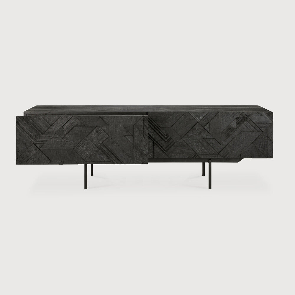 Featuring Graphic TV Cupboard by Ethnicraft at Amethyst Home. In his quest to add movement to the surface, our designer Alain van Havre started layering and combining triangular shapes. Before he knew it, he had created an interesting composition out of teak. Originally used for our popular Teak Graphic sideboard, the pattern now translates perfectly to a new TV cupboard.
This Graphic TV . Amethyst Home provides interior design services, furniture, rugs, and lighting in the Kansas City metro area.