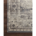 Featuring soft motifs in a carefully curated color palate of grey, black, ivory and hints of blue, the Hathaway Steel / Ivory area rug captures the essence of one-of-a-kind vintage or antique area rug. This rug is ideal for high traffic areas such as living rooms, dining rooms, kitchens, hallways, and entryways.