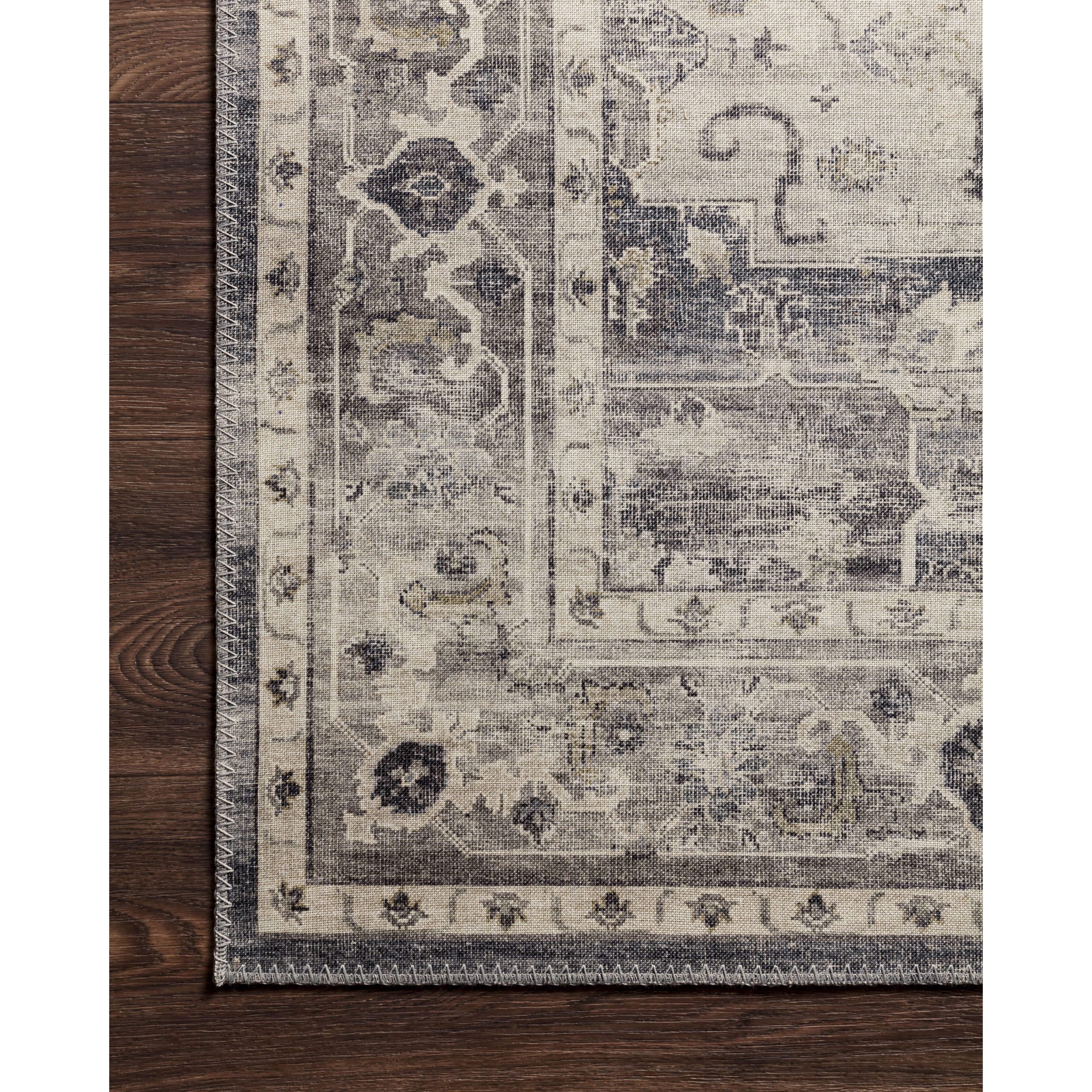 Featuring soft motifs in a carefully curated color palate of grey, black, ivory and hints of blue, the Hathaway Steel / Ivory area rug captures the essence of one-of-a-kind vintage or antique area rug. This rug is ideal for high traffic areas such as living rooms, dining rooms, kitchens, hallways, and entryways.