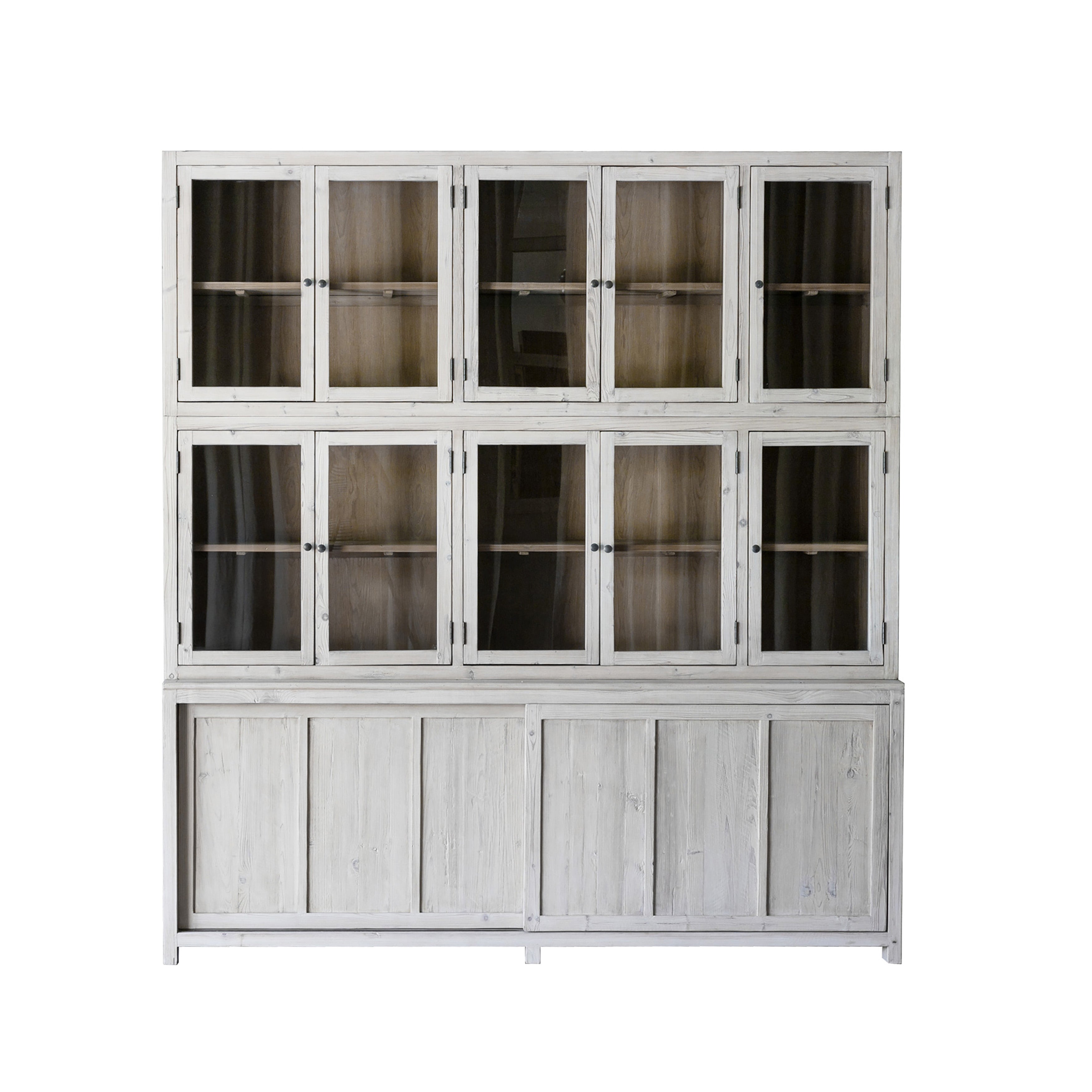 This Haley Cabinet has ample storage, with glass door panels opening to shelves and a bottom sliding door that opens to more shelves. Made from reclaimed pine with a white wash grey sealed finish, this brings an antique feel to any room. Reclaimed Pine White Wash Grey Sealed Finish Flat Glass Door Panels