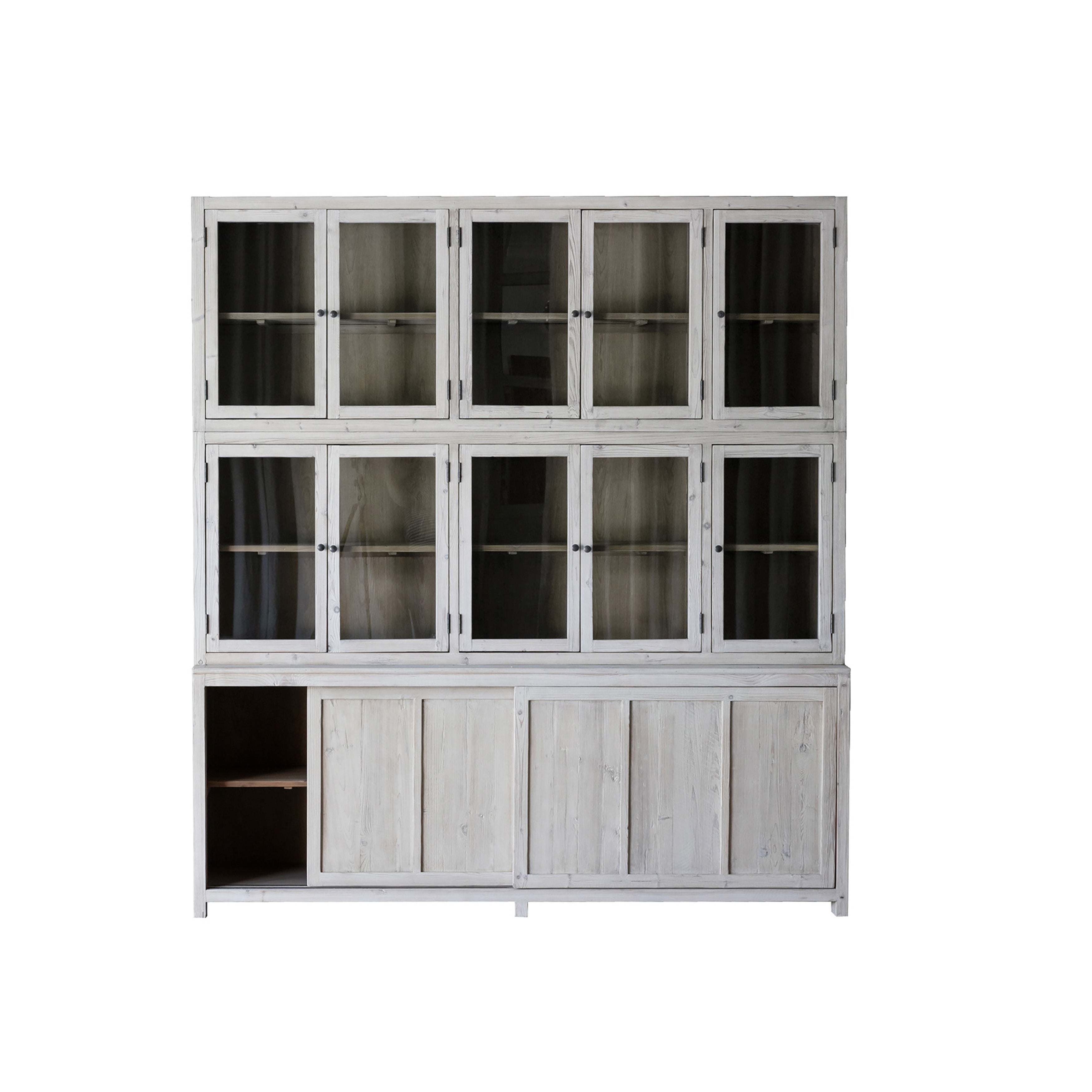 This Haley Cabinet has ample storage, with glass door panels opening to shelves and a bottom sliding door that opens to more shelves. Made from reclaimed pine with a white wash grey sealed finish, this brings an antique feel to any room. Reclaimed Pine White Wash Grey Sealed Finish Flat Glass Door Panels