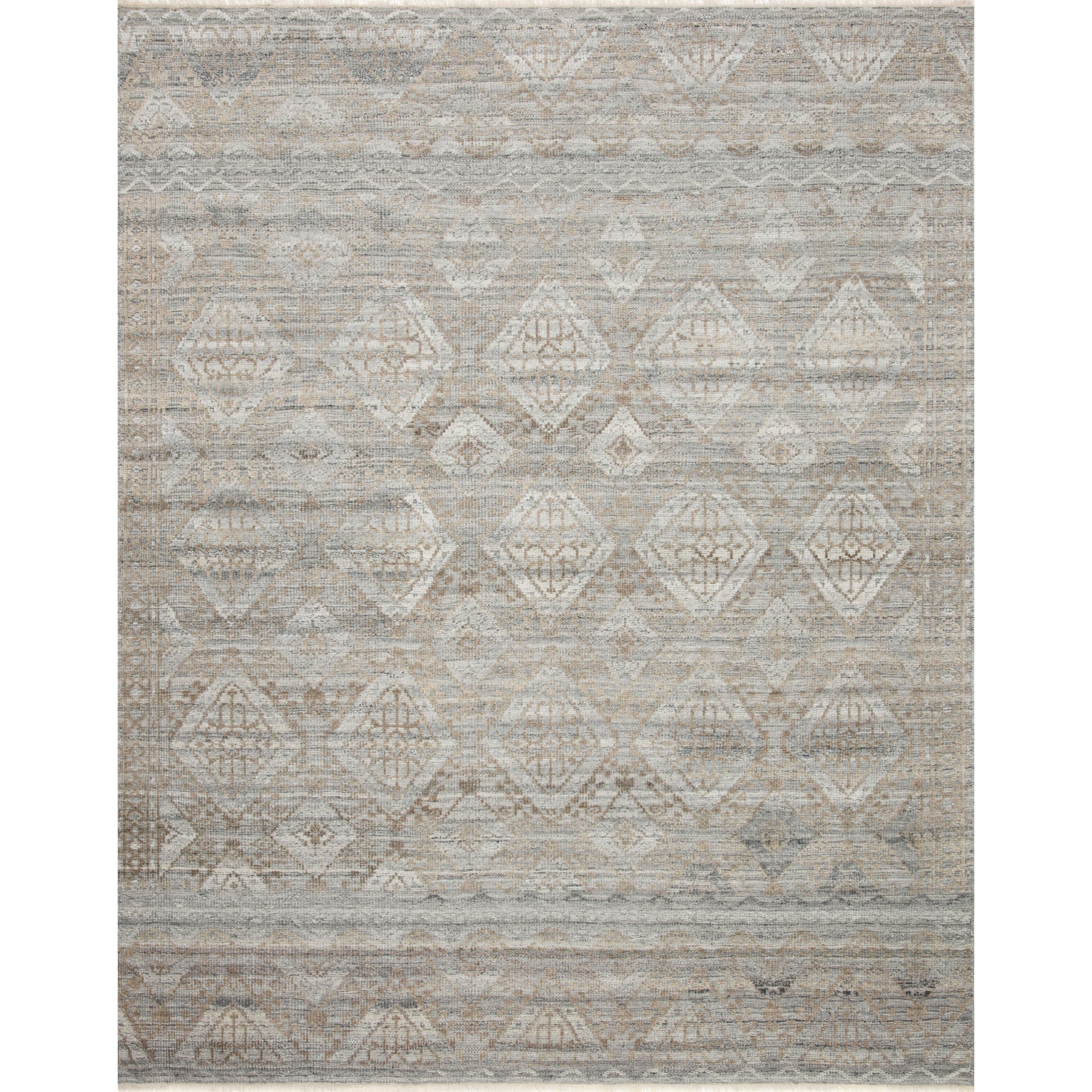 Both timeless and modern, the Idris Granite/Sand area rug from Loloi is hand-knotted in colors of granite, grey, and ivory. The tonal series features an elevated texture, accentuating the detailed pattern. The Idris Granite/Sand rug, also known as ID-01 Granite/Sand, is hand-knotted of 70% Viscose and 30% Wool.