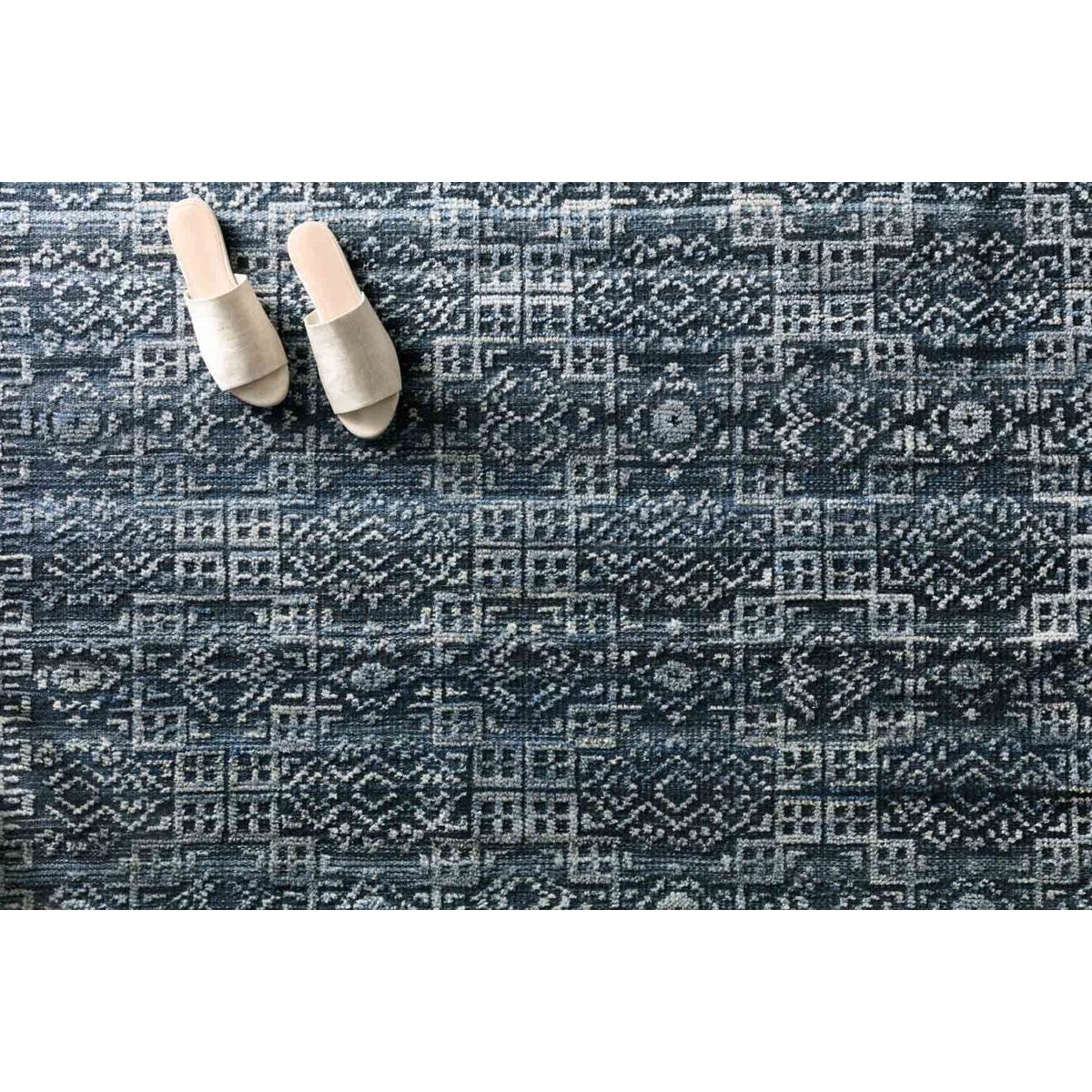 Featuring Idris Ink Hand-Knotted Rug by Loloi at Amethyst Home. The Idris Ink area rug from Loloi is meticulously hand-knotted of viscose and wool. You will love this rug because the rug is:

Perfect for entryways, living rooms, and bedrooms
Easy to clean and maintain
Gorgeous with the intricate pattern and patina
Warms up any room with the high / low .  Amethyst Home provides interior design, new home construction design consulting, vintage area rugs, and lighting in the Winter Garden metro area.