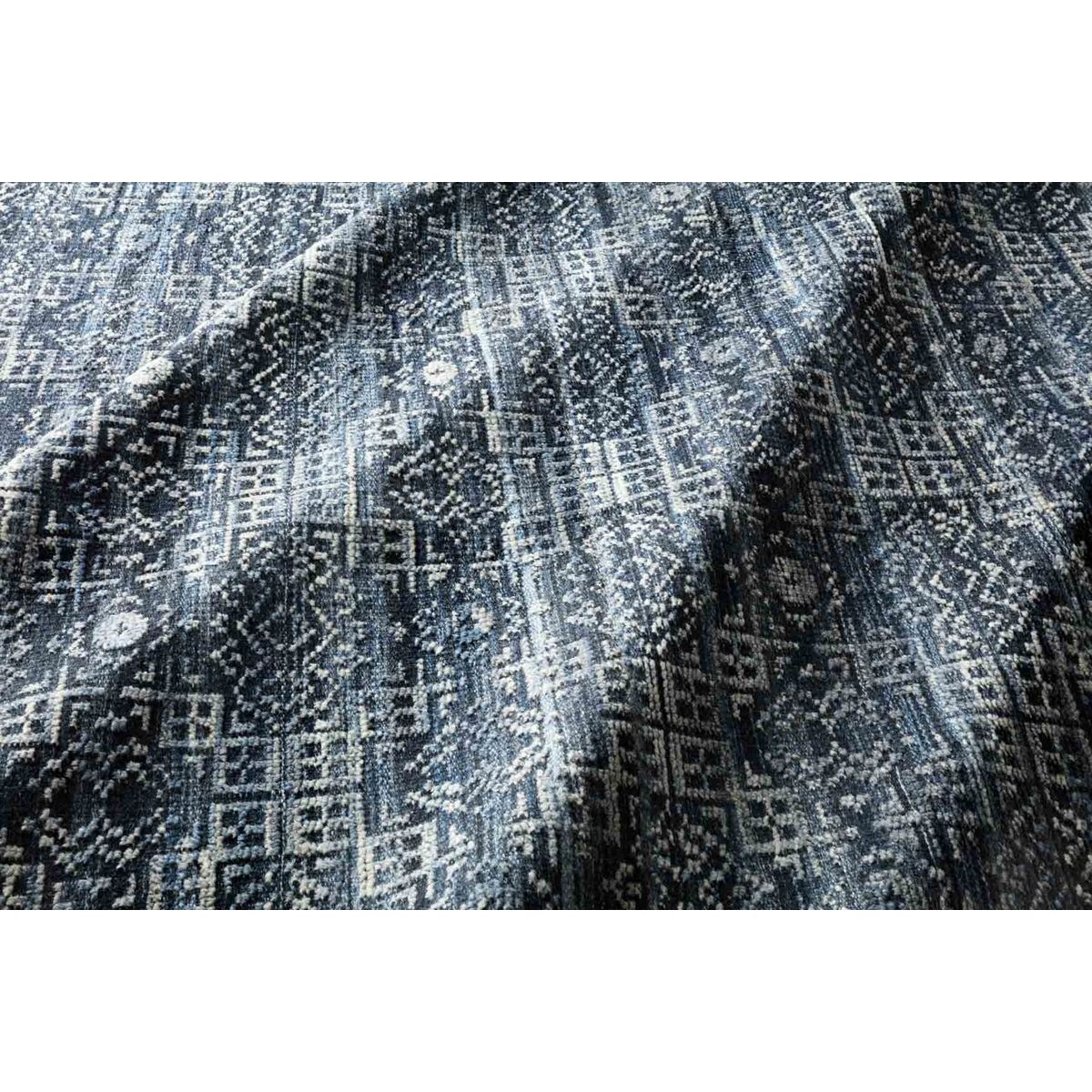 Featuring Idris Ink Hand-Knotted Rug by Loloi at Amethyst Home. The Idris Ink area rug from Loloi is meticulously hand-knotted of viscose and wool. You will love this rug because the rug is:

Perfect for entryways, living rooms, and bedrooms
Easy to clean and maintain
Gorgeous with the intricate pattern and patina
Warms up any room with the high / low pile

Ha.  Amethyst Home provides interior design, new home construction design consulting, vintage area rugs, and lighting in the Miami metro area.