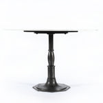 The Lucy Round Marble Dining Table from Four Hands beautifully captures the French industrial meets dining table vibe. Beautifully detailed, 8-sided cast iron pedestal supports a dramatic white marble top with a bull-nosed edge.