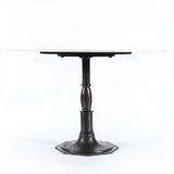 The Lucy Round Marble Dining Table from Four Hands beautifully captures the French industrial meets dining table vibe. Beautifully detailed, 8-sided cast iron pedestal supports a dramatic white marble top with a bull-nosed edge.