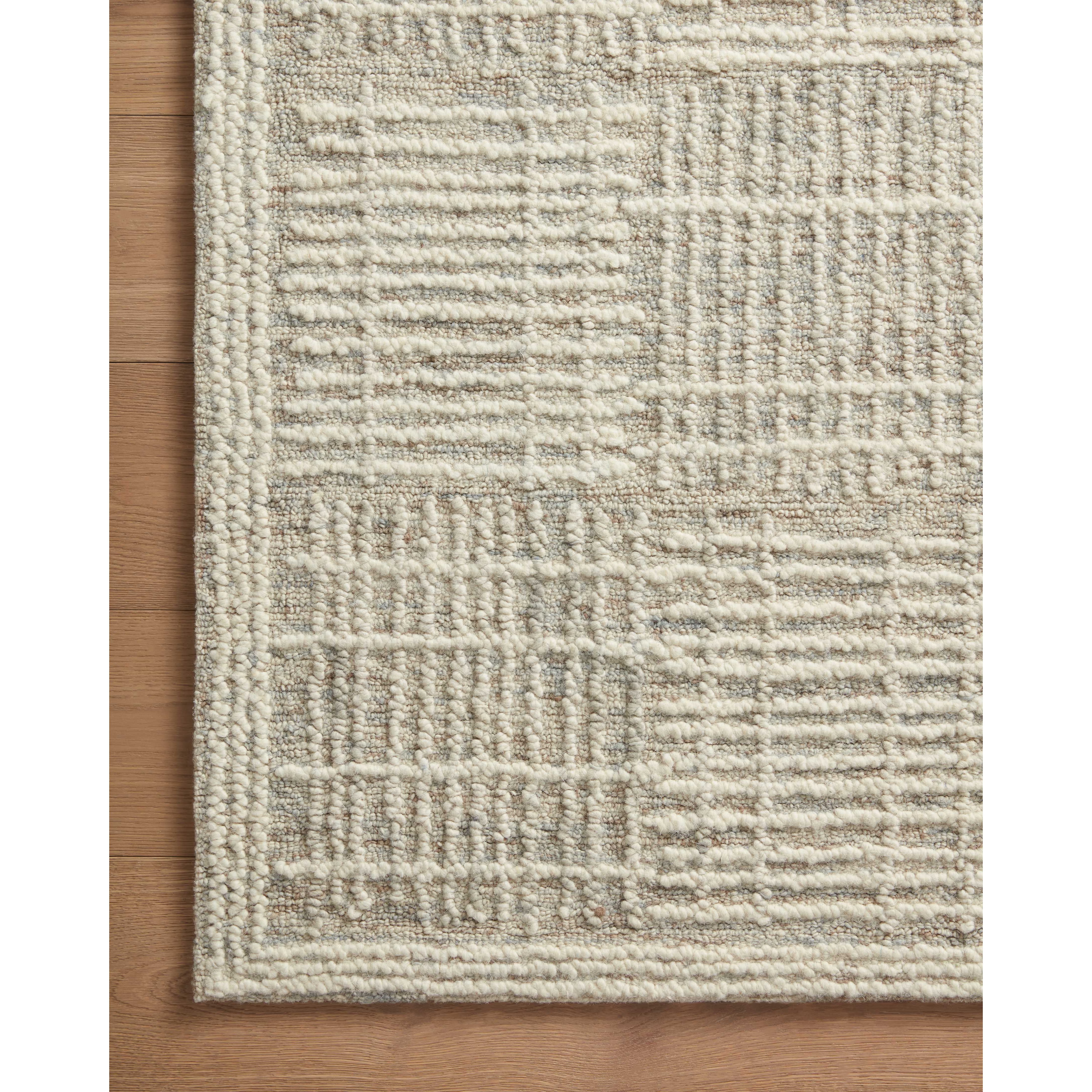 Hand-crafted with a combination of thick and fine yarns, the Tallulah Mist / Ivory Rug area rug creates dynamic dimension in living rooms, bedrooms, and more. The thicker yarns define the abstract, linear design, giving the rug a distinct high-low texture and sense of movement. Tallulah's soft, neutral palettes have a depth of tone inspired by watercolor pigmentation. Amethyst Home provides interior design, new construction, custom furniture, and area rugs in the Austin metro area.