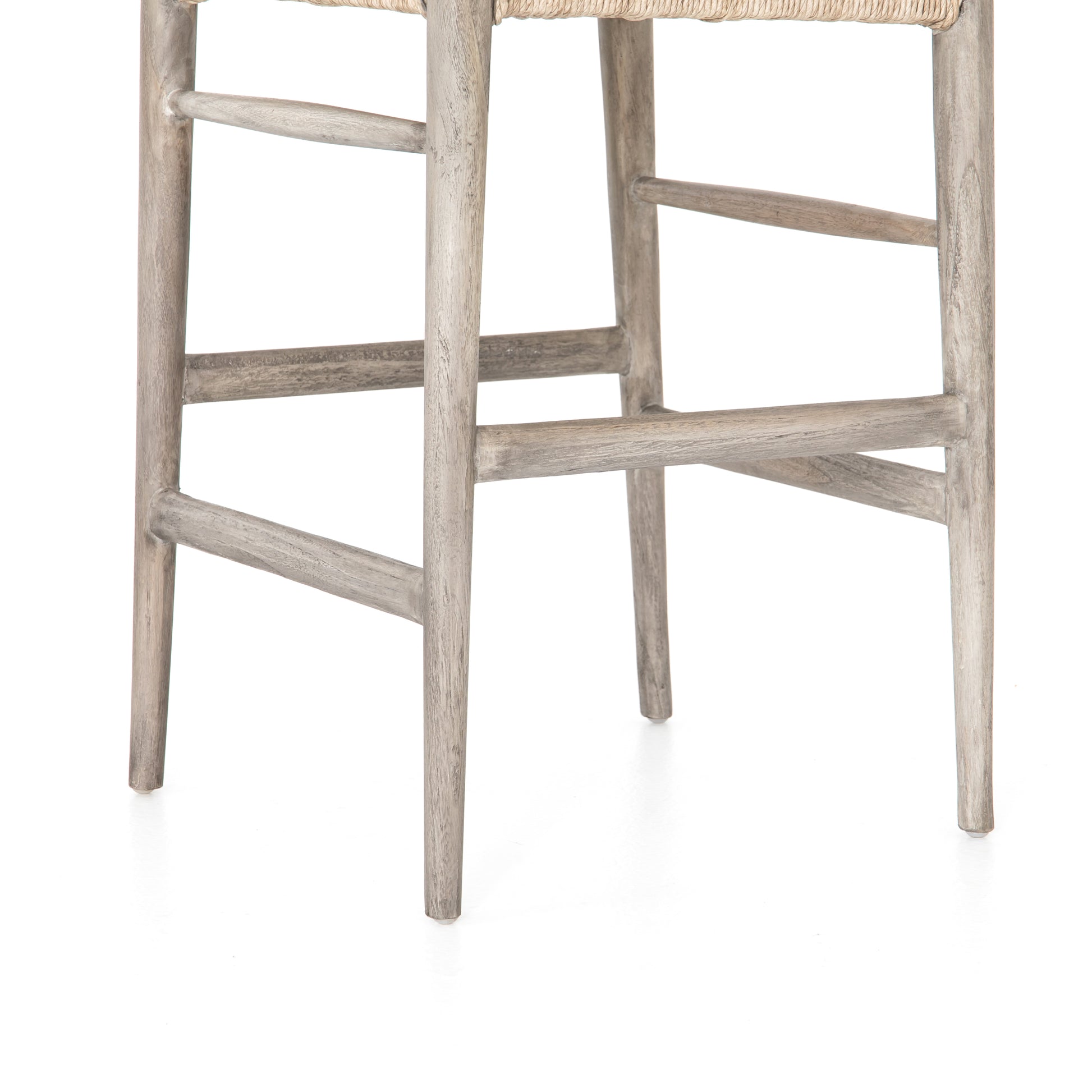 Modern curves redefine the classic wishbone-style counter stool. Vintage white all-weather wicker is woven for a dose of fresh texture within weathered grey teak framing. Cover or store indoors during inclement weather and when not in use.  Pictured in Weathered Grey. Also available in Black Teak and Matte Sealed Teak.  Overall Size: 21.50"w x 22.50"d x 38.50"h Seat Depth: 18.25" Seat Height: 26.50"