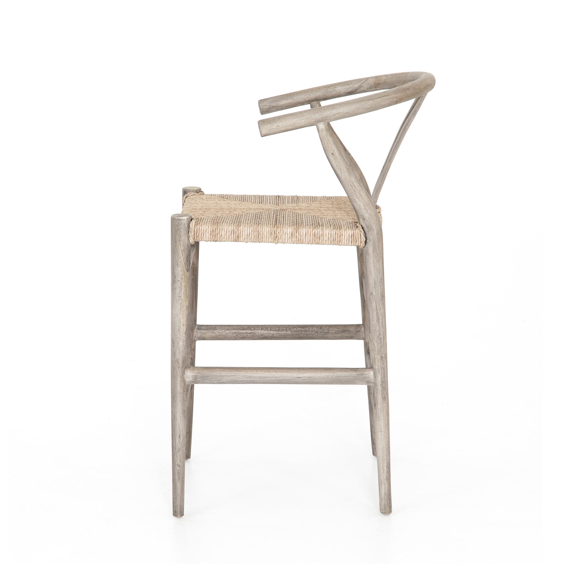Modern curves redefine the classic wishbone-style counter stool. Vintage white all-weather wicker is woven for a dose of fresh texture within weathered grey teak framing. Cover or store indoors during inclement weather and when not in use.  Pictured in Weathered Grey. Also available in Black Teak and Matte Sealed Teak.  Overall Size: 21.50"w x 22.50"d x 38.50"h Seat Depth: 18.25" Seat Height: 26.50"